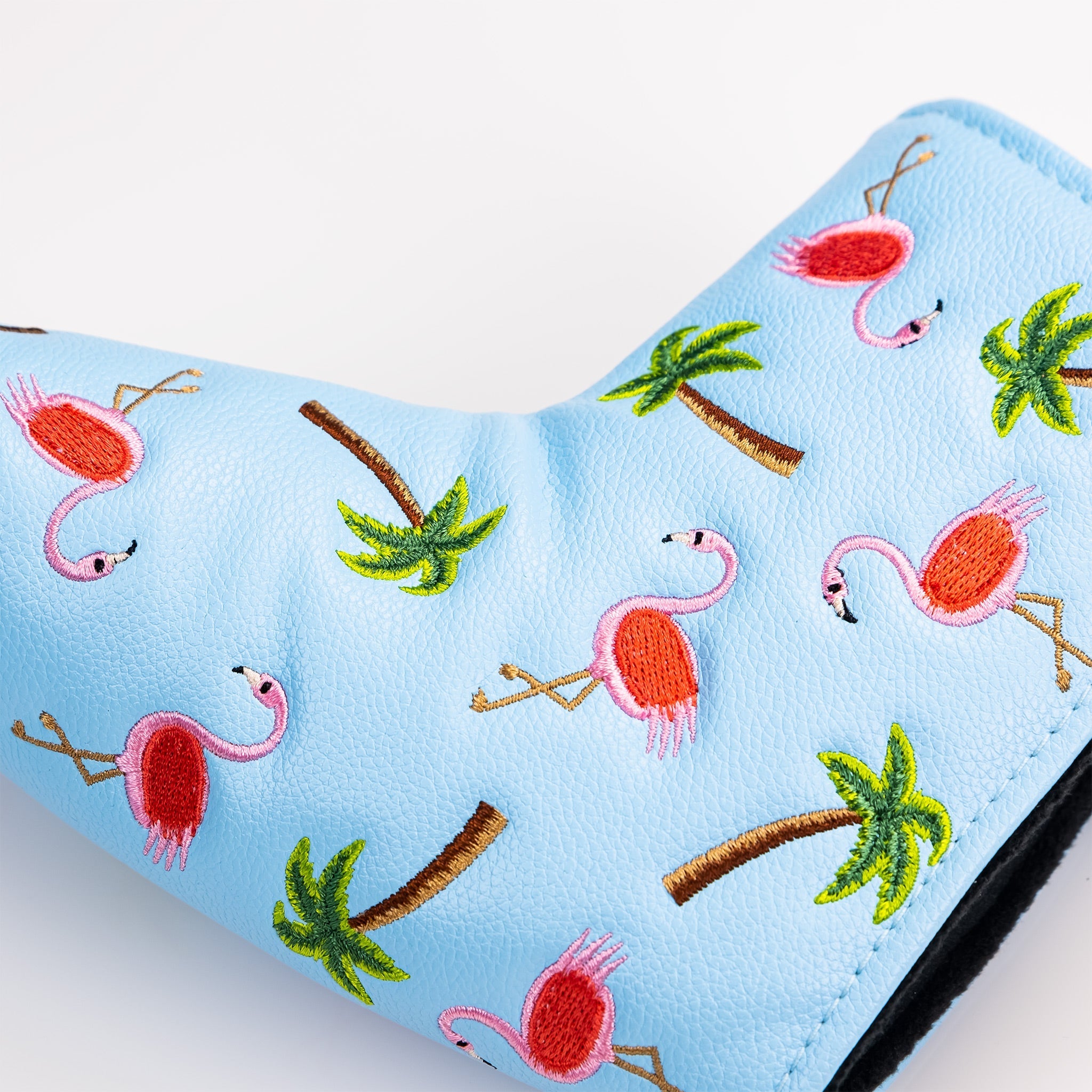Bright blue blade putter cover featuring colorful embroidered flamingos and palm trees, perfect for stylish golfers.