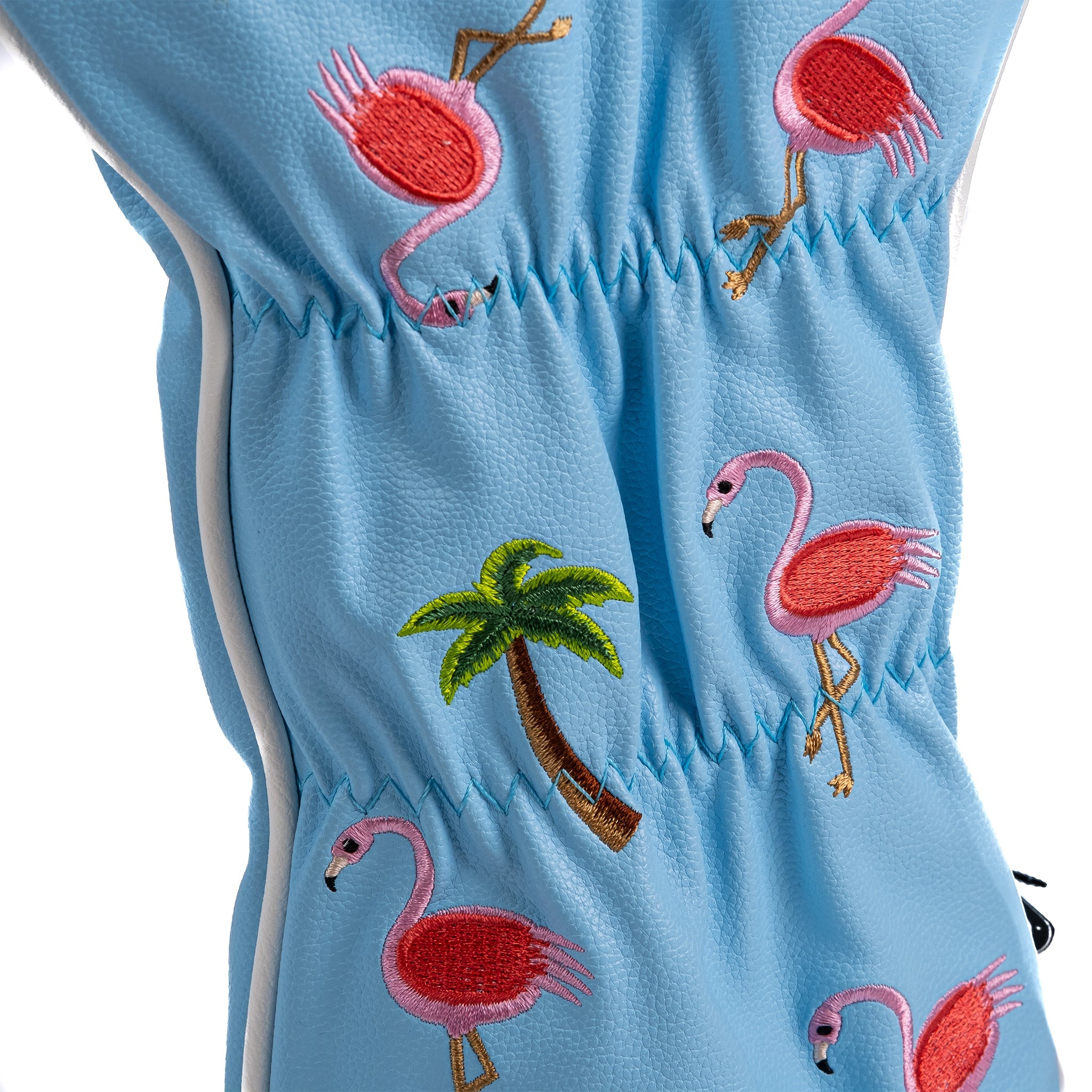 Bright blue driver cover featuring playful embroidered flamingos and a palm tree, perfect for adding flair to your golf gear.