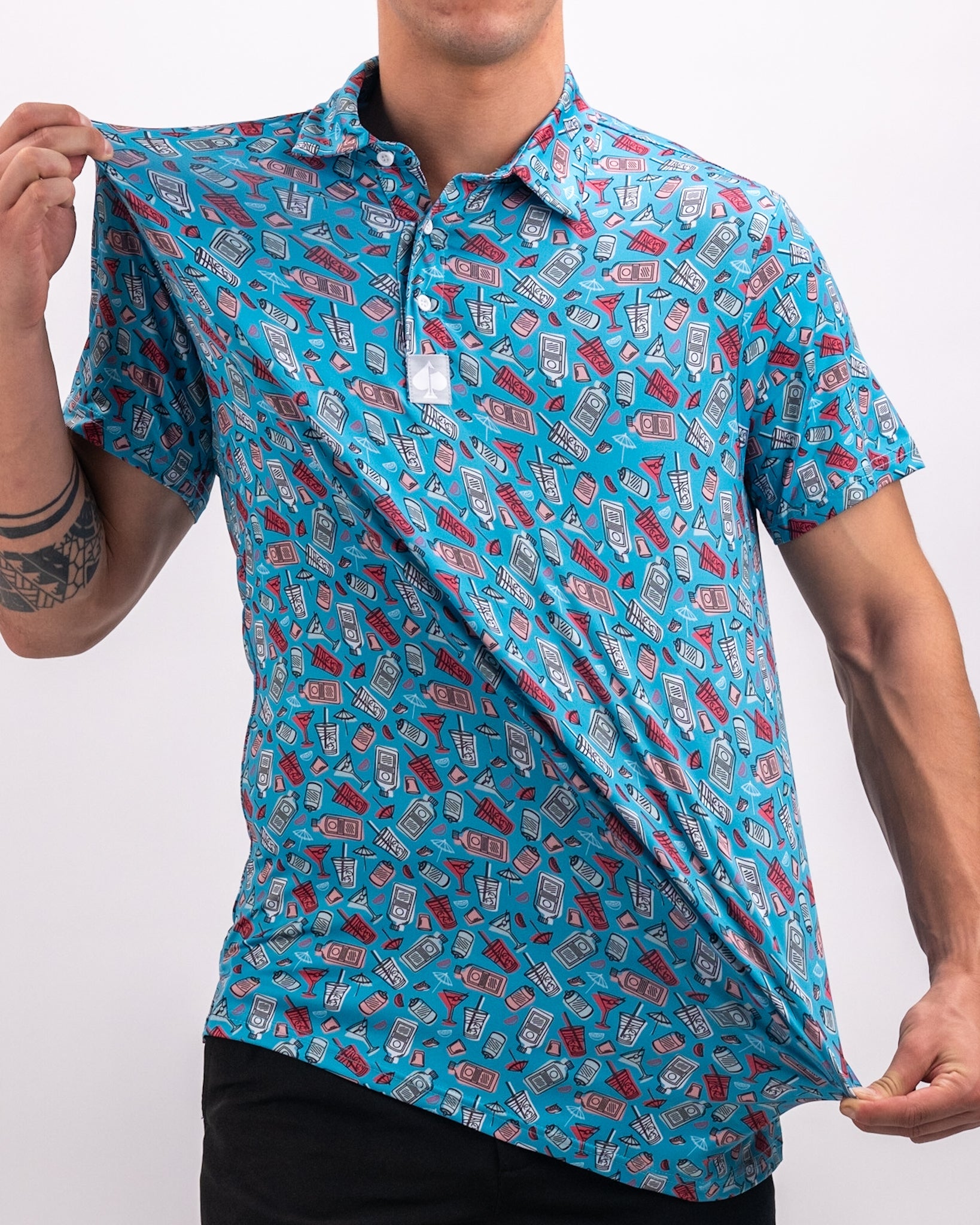 Bold blue golf polo shirt featuring a playful pattern of drinks and cocktail glasses, perfect for stylish golfers.