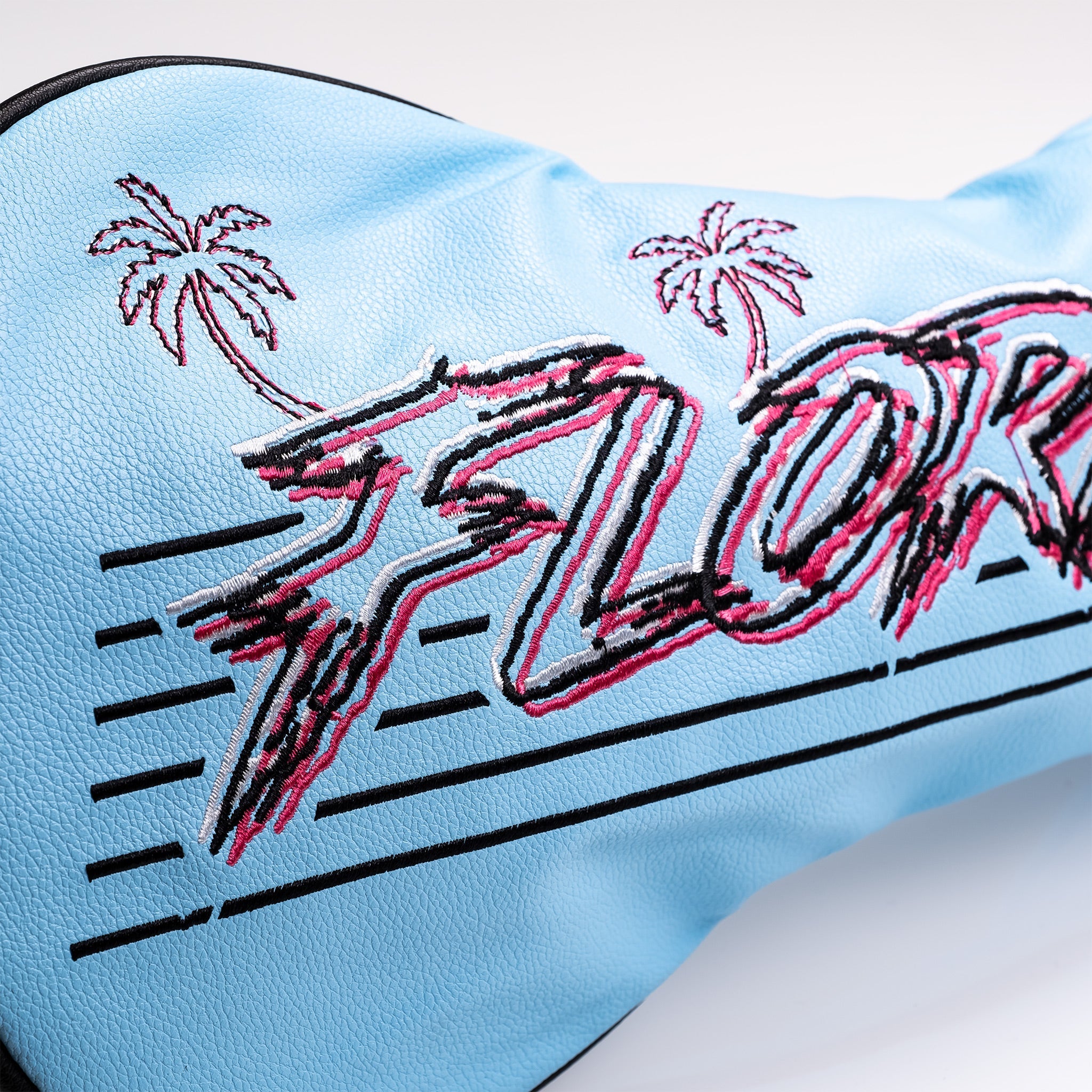 Bold blue fairway cover featuring vibrant "Florida" embroidery and palm tree designs, perfect for stylish golfers.