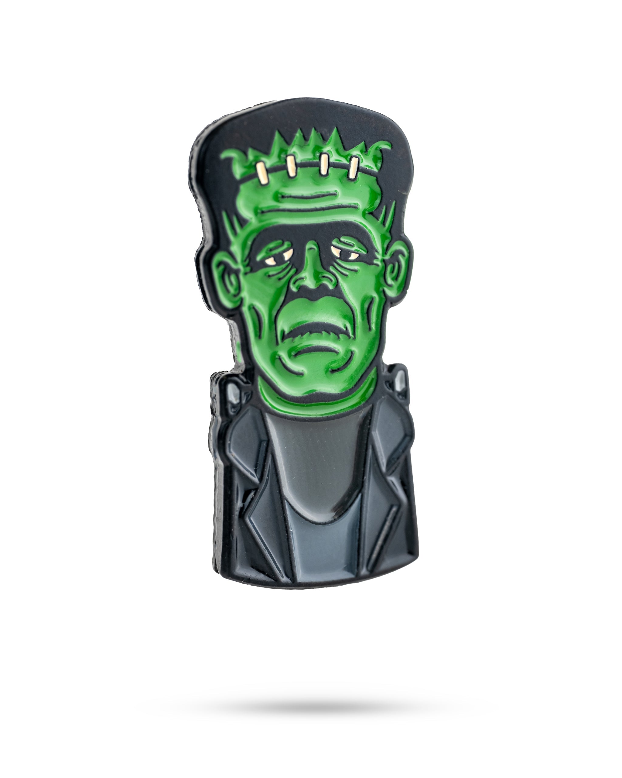 Frankenstein-themed ball marker featuring a green monster face with stitched forehead and black suit, perfect for golfers.