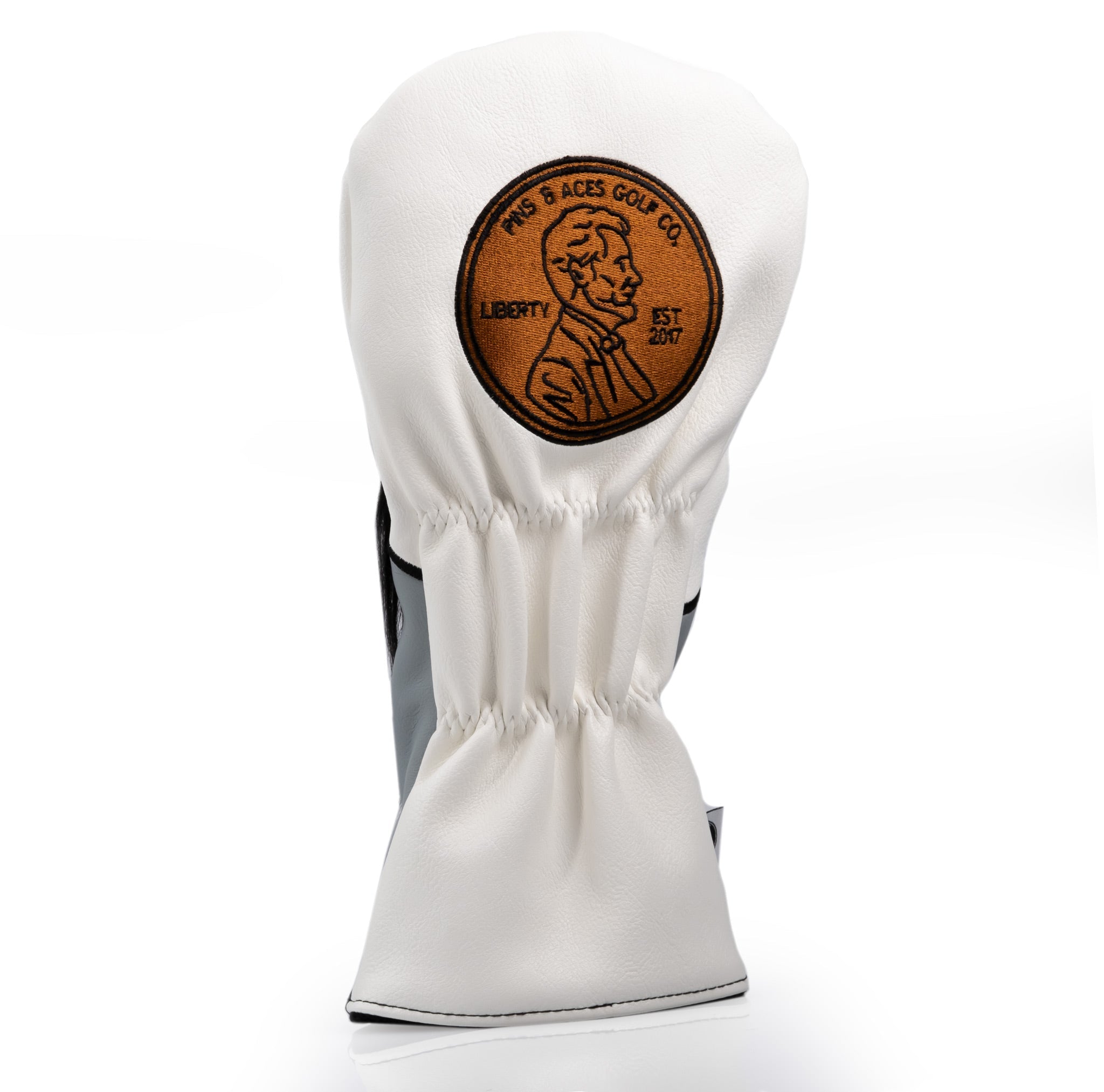 Abe Lincoln driver cover featuring a detailed emblem and classic white leather design for stylish golf protection.