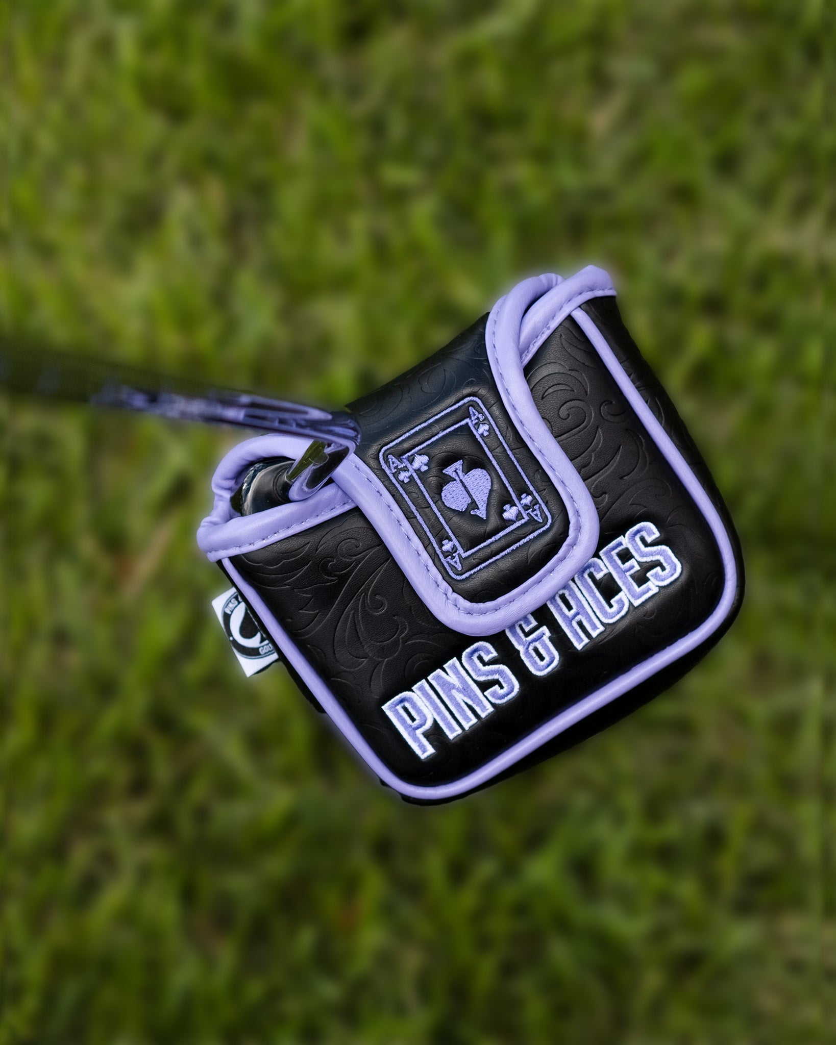 Ace of Spades mallet putter cover featuring a sleek black design with purple accents and embossed detailing.