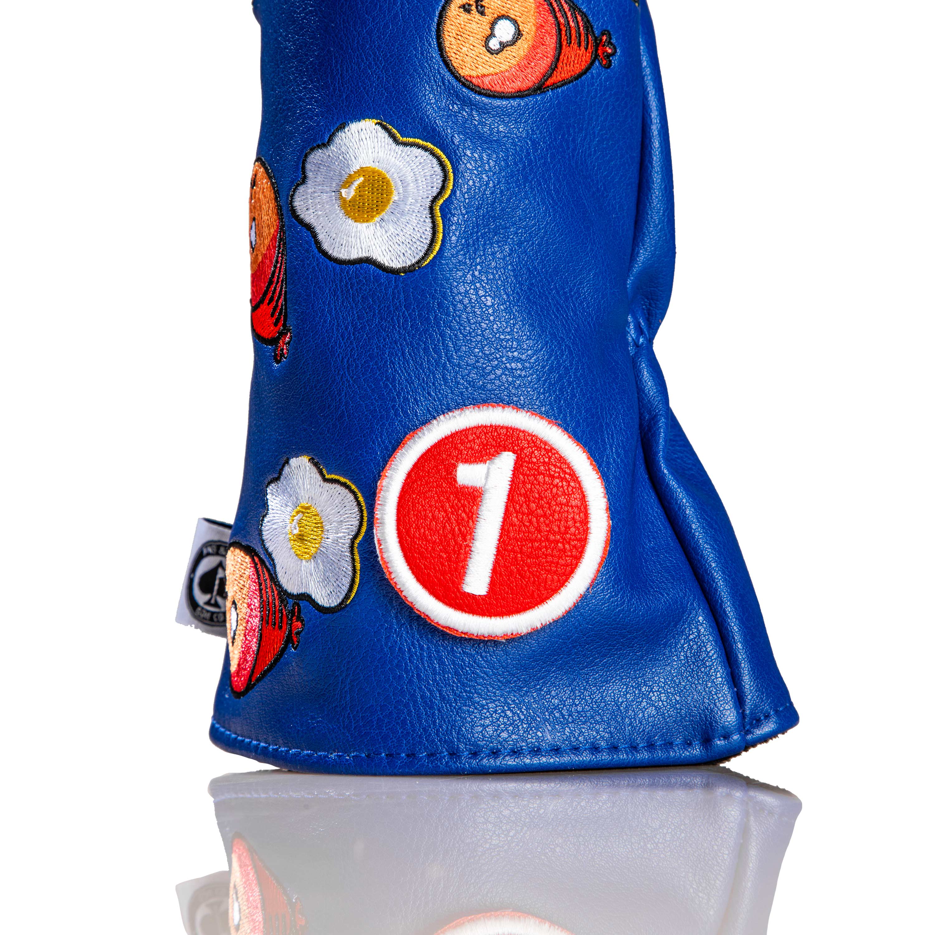 Bold blue driver cover featuring playful ham and egg graphics, with a prominent red number one emblem for standout style.