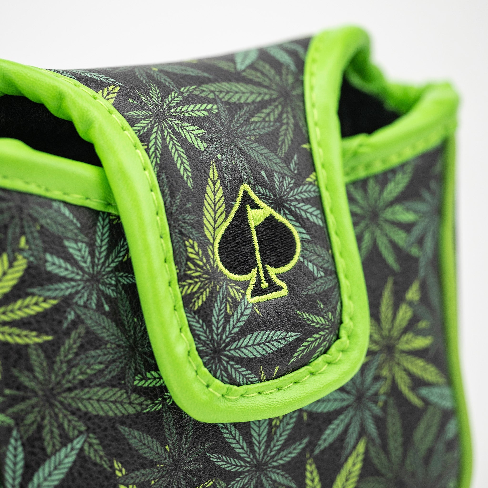 Bold mallet putter cover featuring a vibrant green and black leaf design, perfect for high handicappers seeking style.