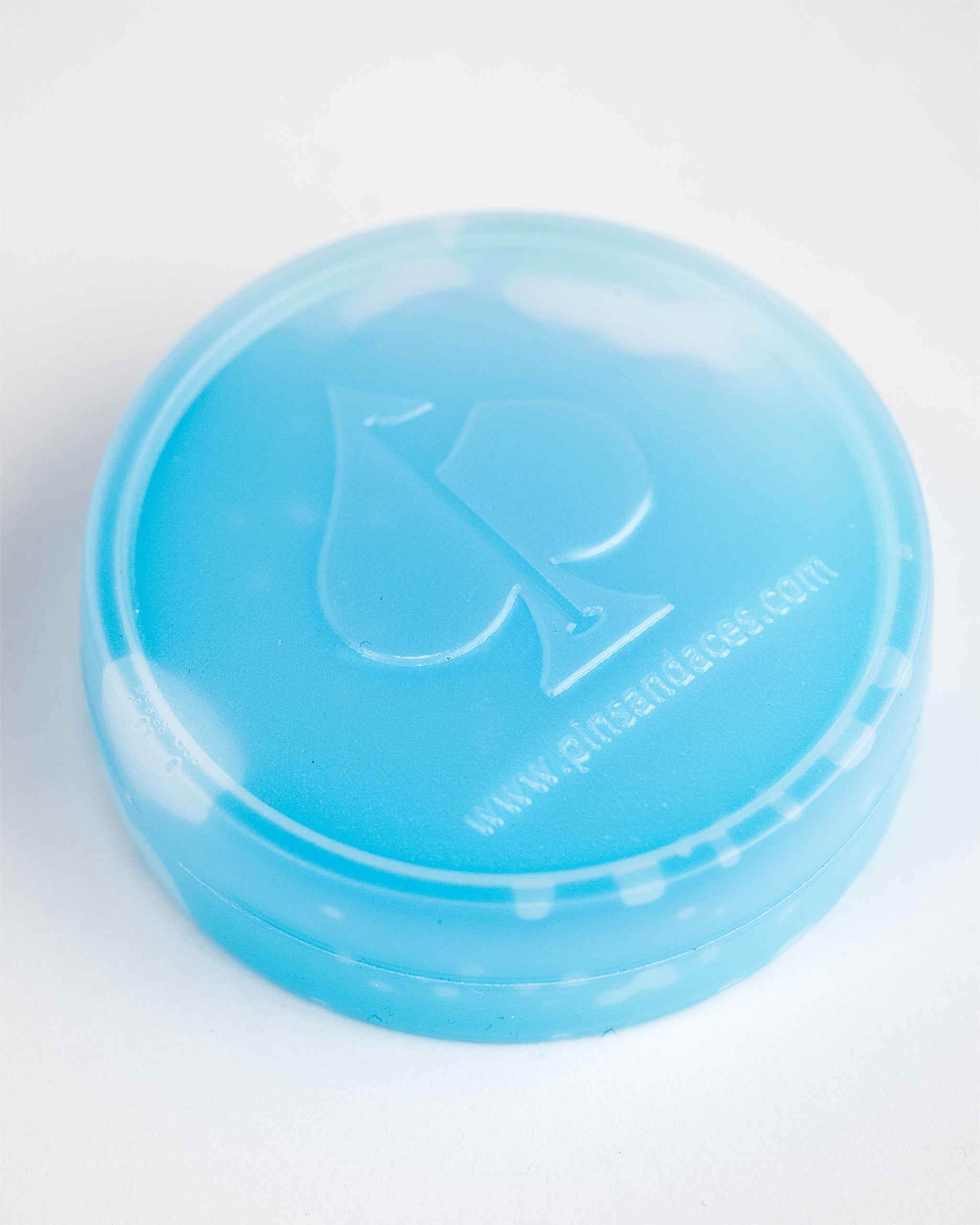 Blue Beer Sleeve Ice Puck designed to keep beverages cold, featuring a logo and smooth surface for easy handling.
