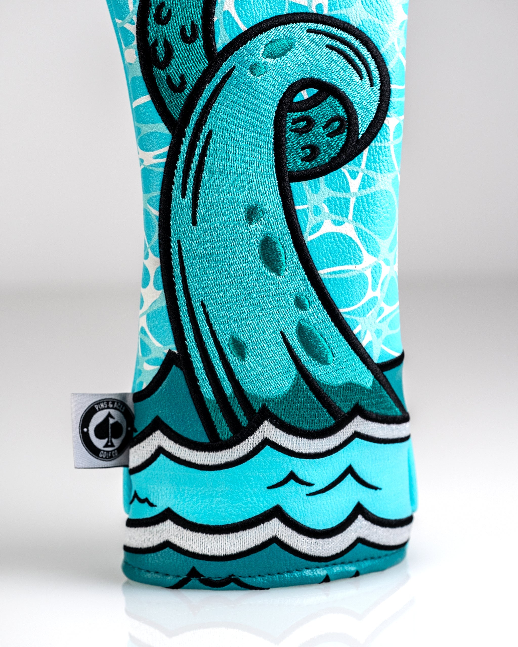 Bold Kraken fairway cover featuring a vibrant octopus tentacle design in turquoise and black, perfect for stylish golfers.