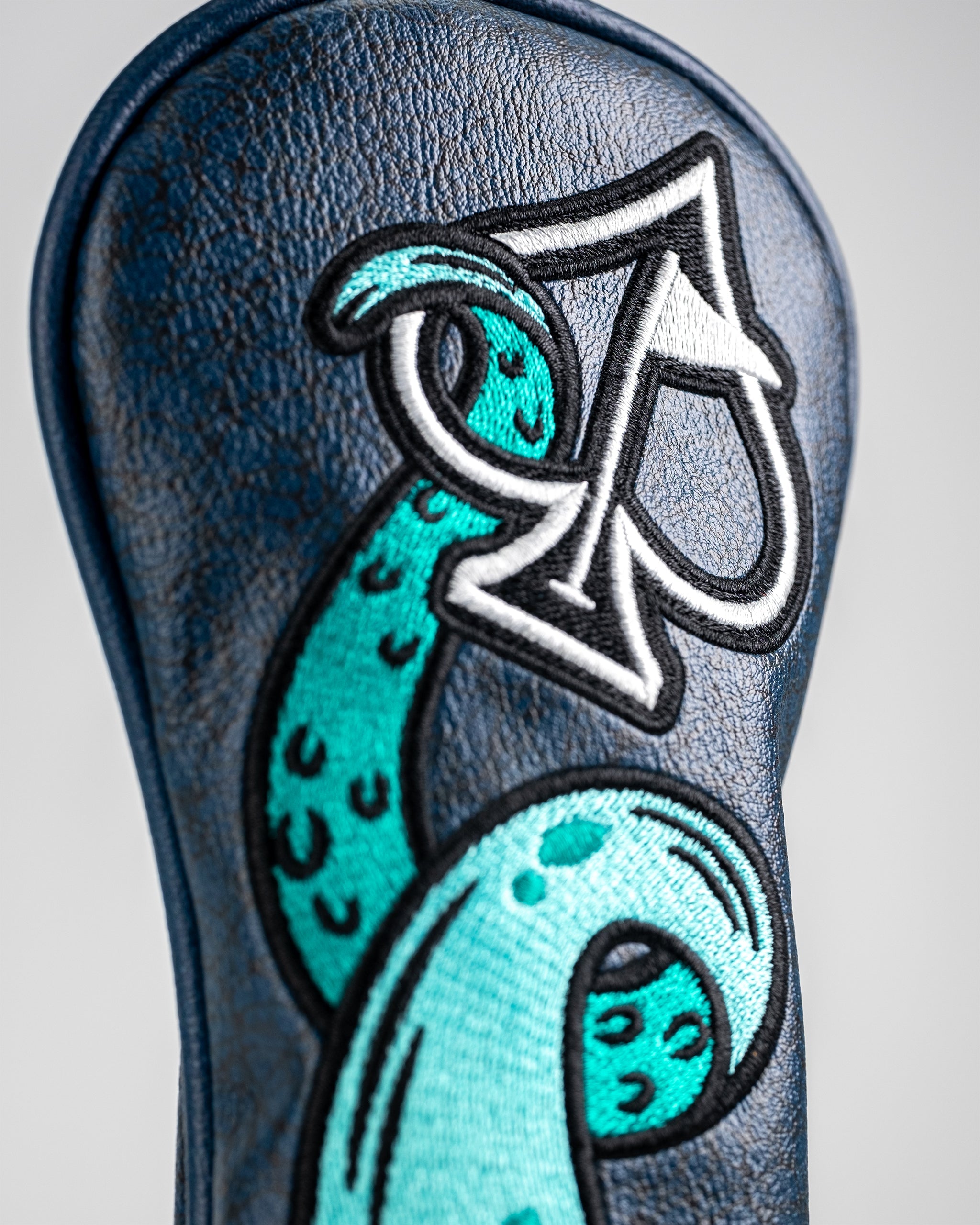 Bold Kraken hybrid cover featuring a striking blue octopus design and an ace of spades emblem, perfect for standout golfers.