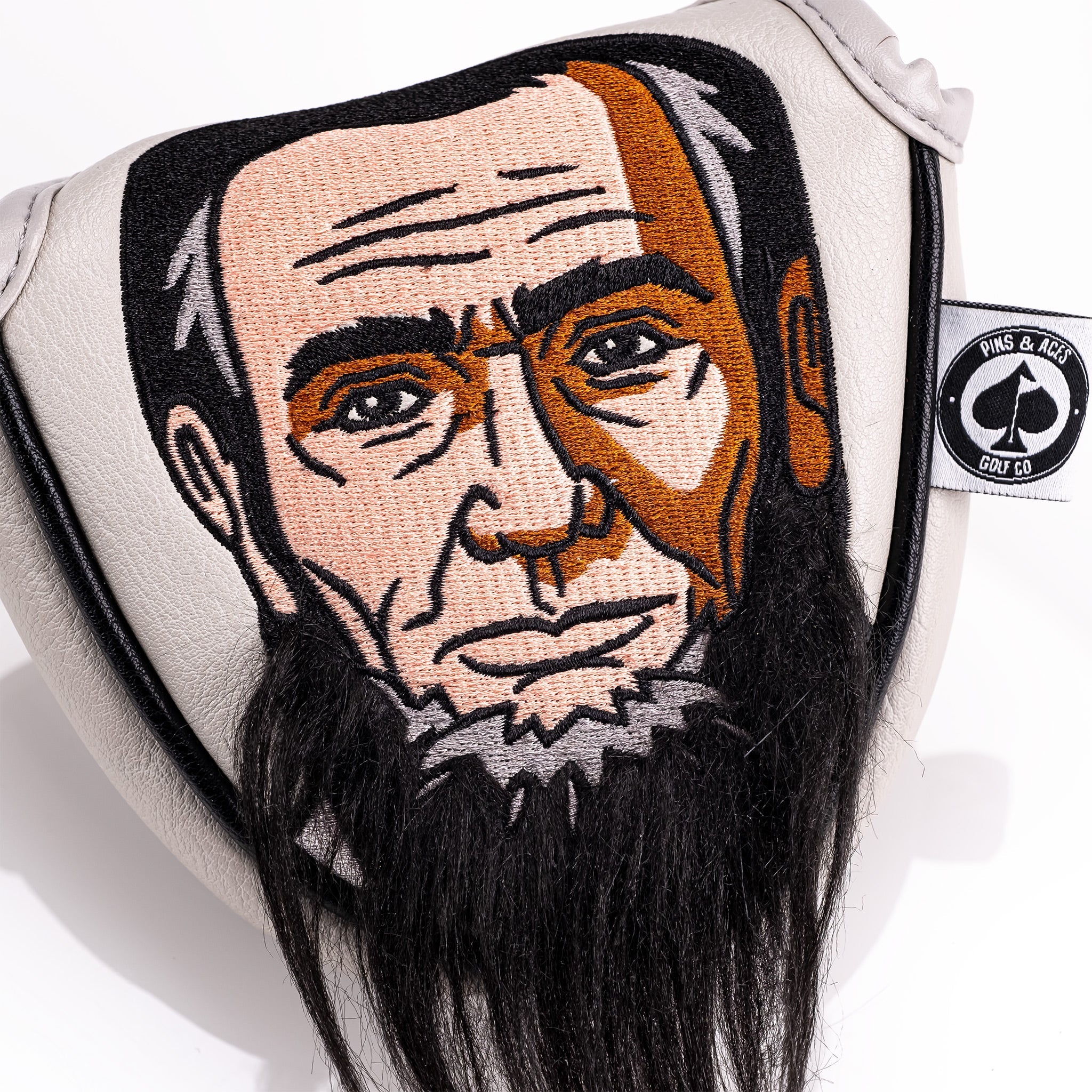 Lincoln mallet putter cover featuring an embroidered design of Abraham Lincoln's face with a detailed beard.