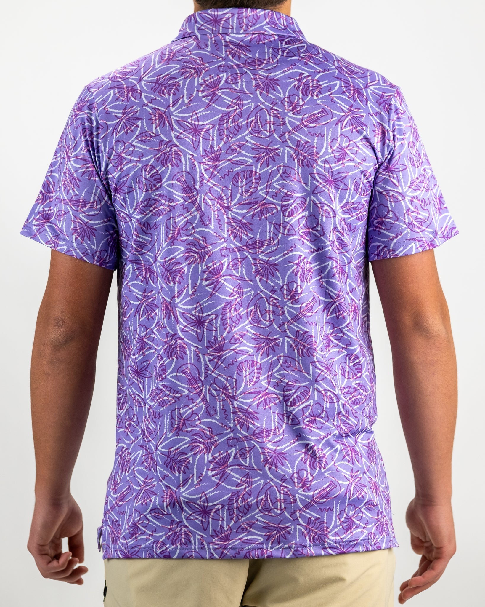 Men's Margaritaville 5 O'Clock Sunset golf shirt featuring a vibrant purple leaf pattern on the back for a stylish look.