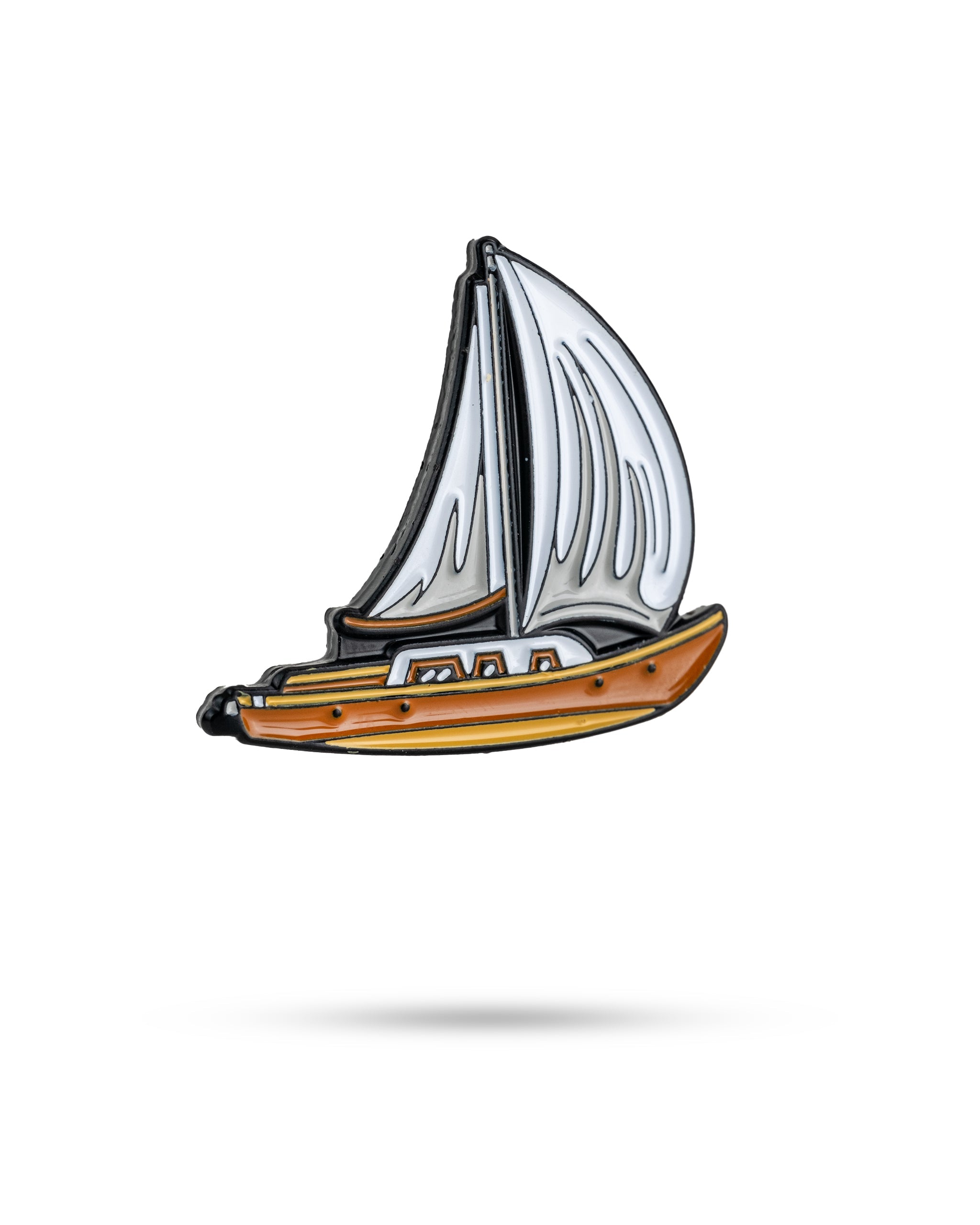 Sailboat-shaped ball marker with a white sail and orange hull, perfect for adding a nautical touch to your golf game.