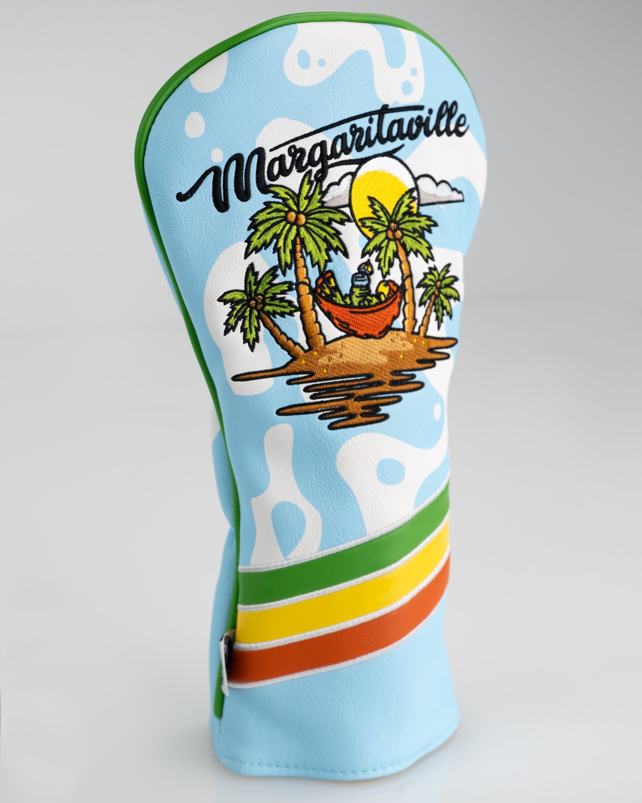 Colorful Margaritaville driver cover featuring a tropical scene with palm trees and a hammock, perfect for stylish golfers.