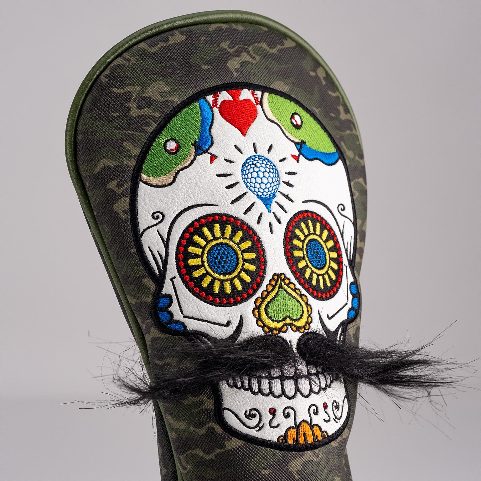 Bold green camo fairway cover featuring a colorful mustache sugar skull design with intricate details and a faux mustache.