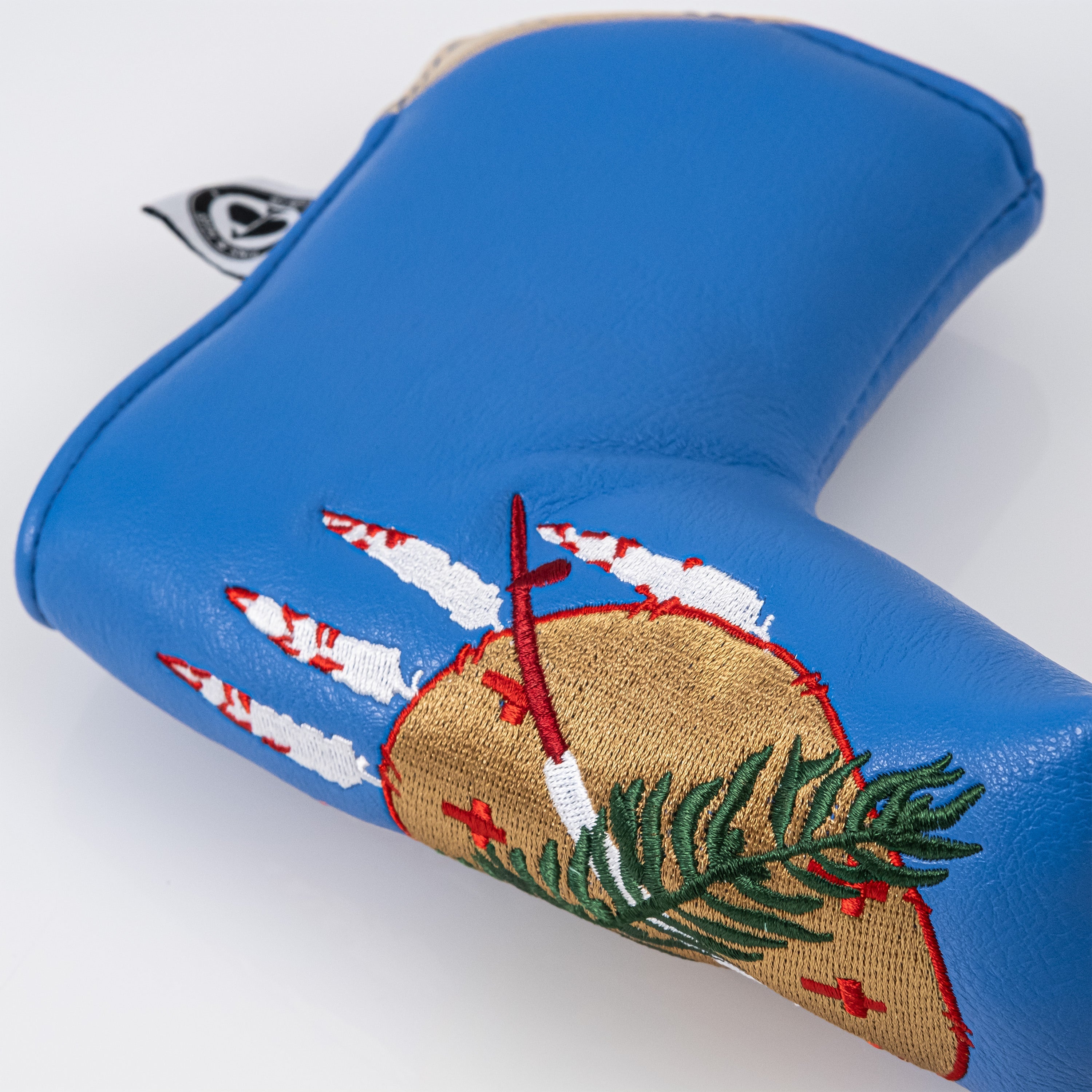 Oklahoma State flag blade putter cover featuring vibrant blue leather with detailed embroidery of traditional symbols.