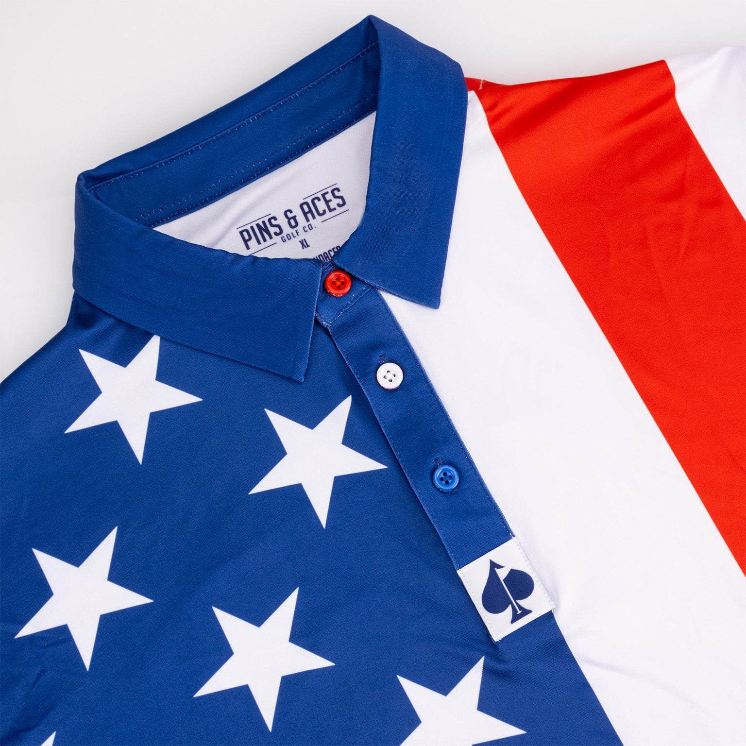 Bold golf polo featuring a patriotic design with red, white, and blue colors and star patterns, perfect for standout style on the course.