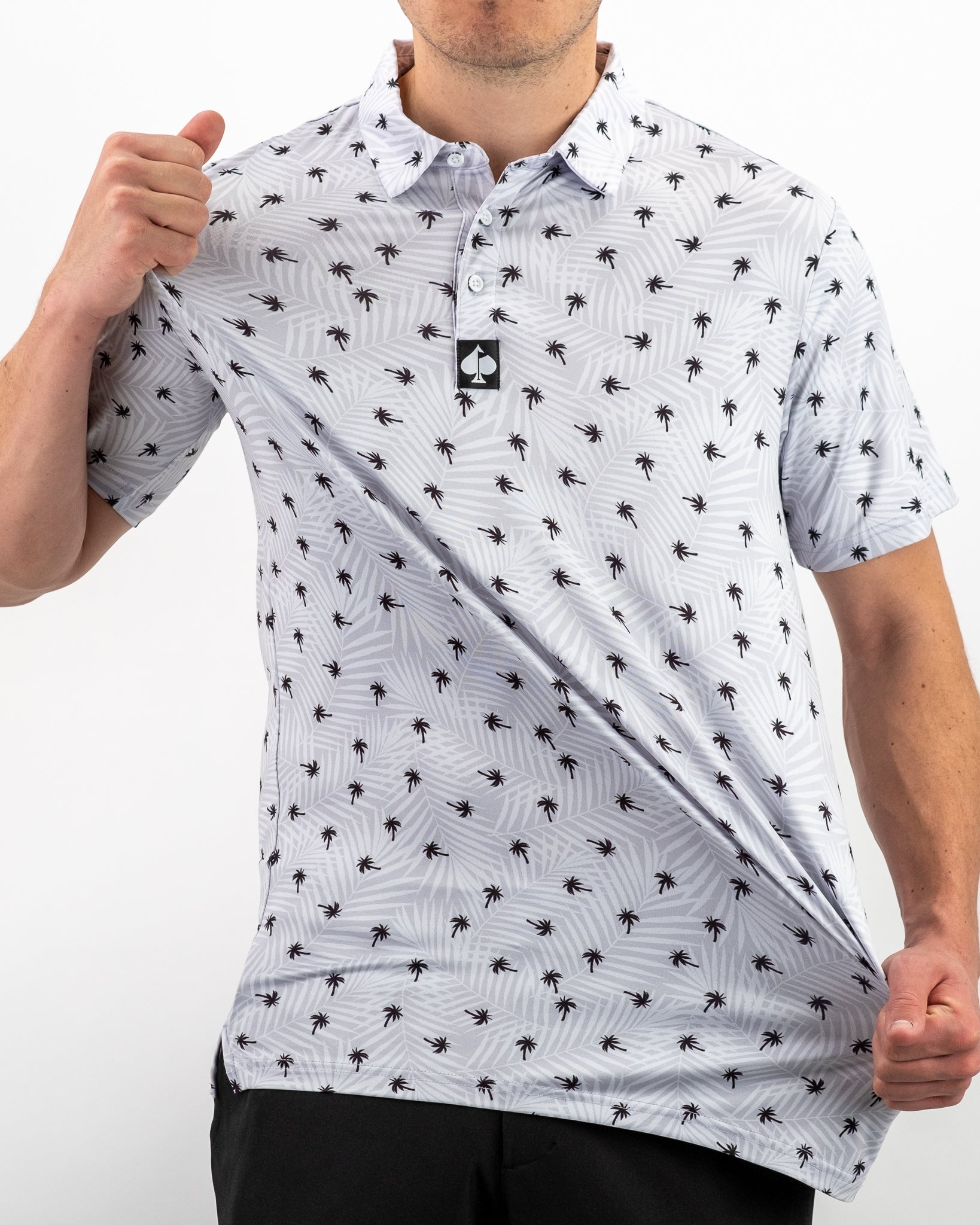Men's golf polo featuring a stylish palm tree pattern, designed for comfort and a standout look on the course.
