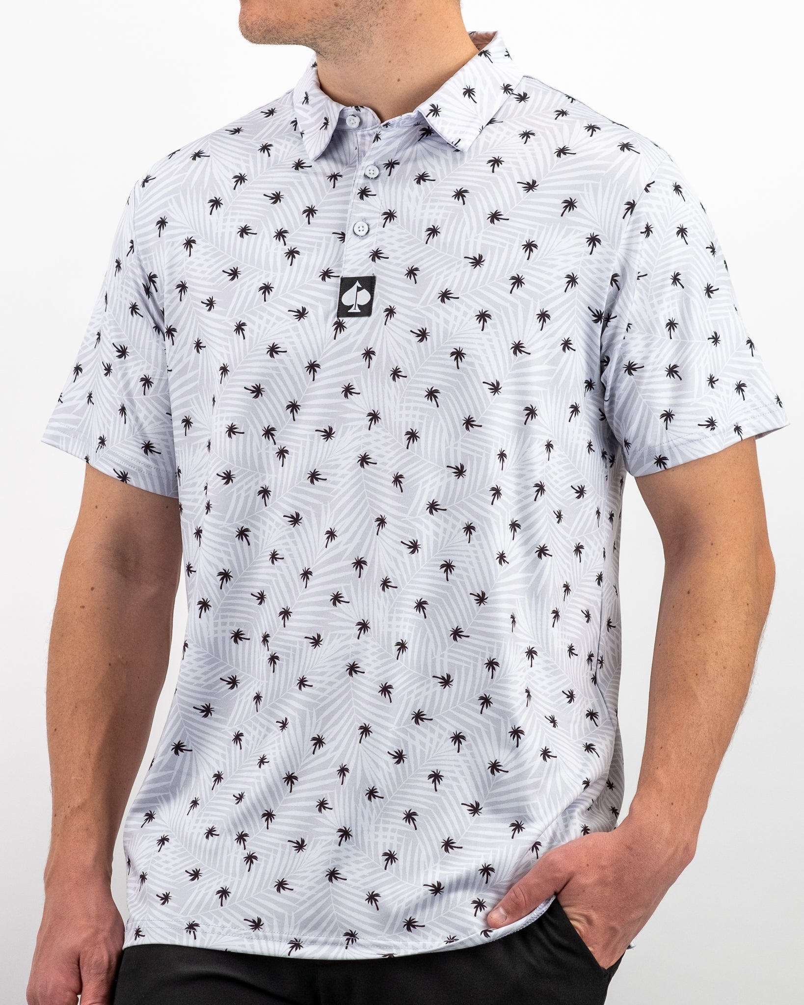 Men's golf polo shirt featuring a palm tree pattern on a light background, designed for a stylish and comfortable fit on the course.