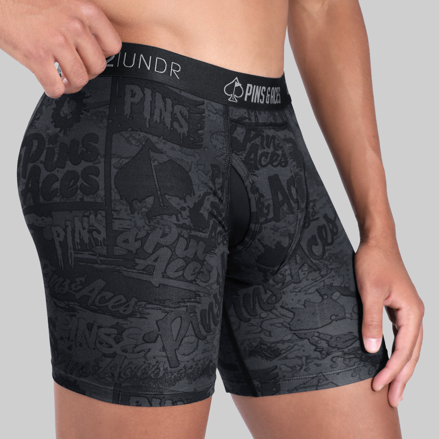 Men's 6-inch box briefs featuring a graffiti splatter design, ideal for comfort and style on and off the golf course.