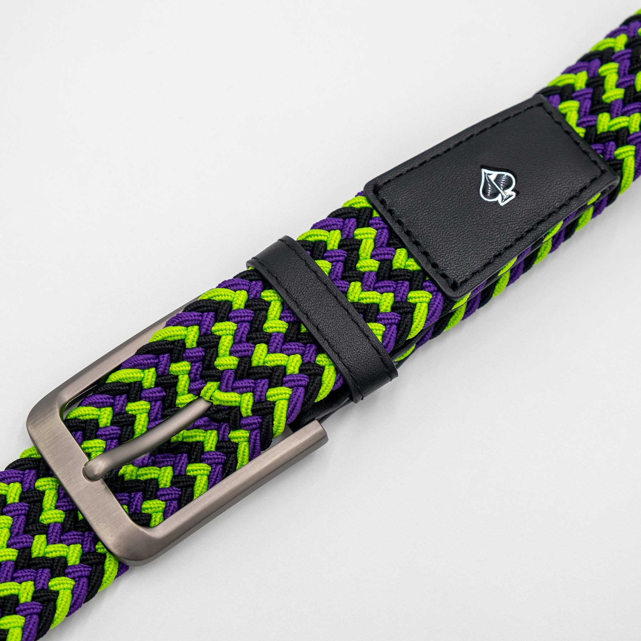 Colorful woven belt featuring a purple and green pattern with a sleek black leather strap and a metallic buckle.