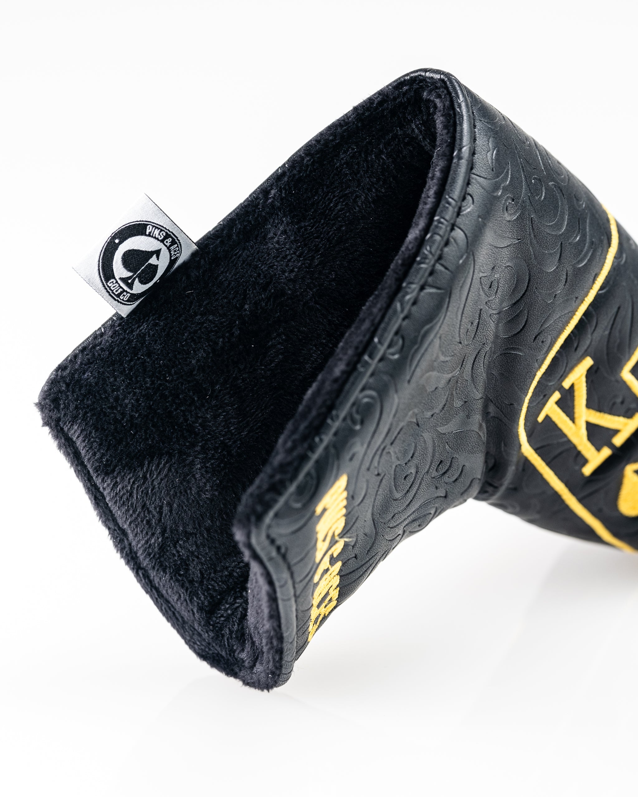 Black and gold Ace of Spades blade putter cover featuring a soft interior and stylish embossed design for golfers.
