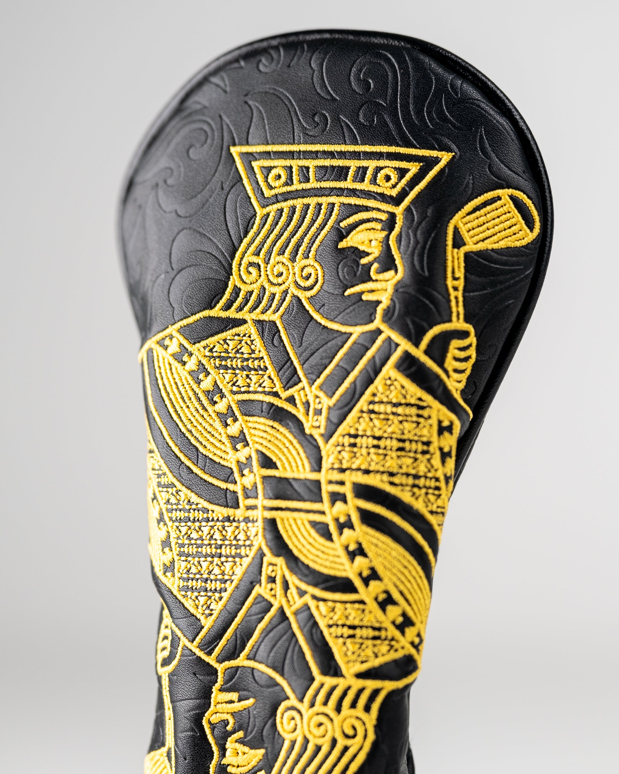 Black and gold hybrid golf cover featuring an intricately embroidered Jack of Spades design for a bold look on the course.