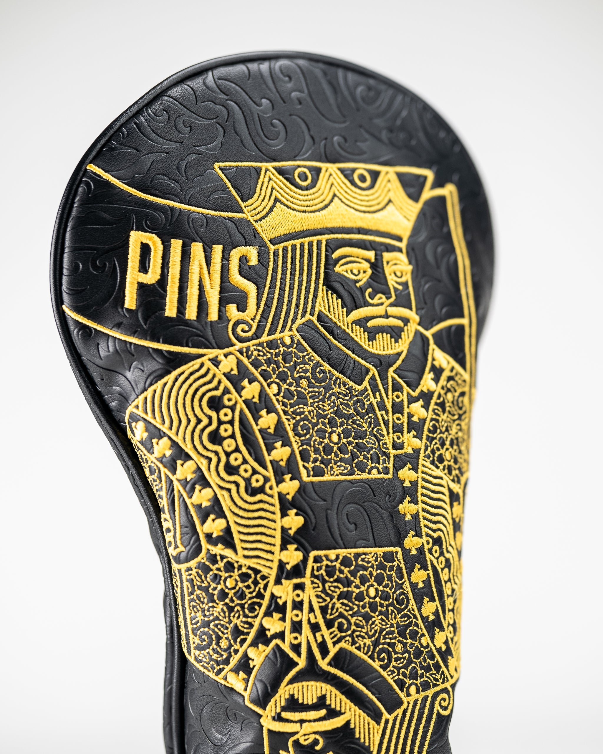 Black and gold driver cover featuring a detailed King of Spades design, perfect for golfers wanting to stand out.