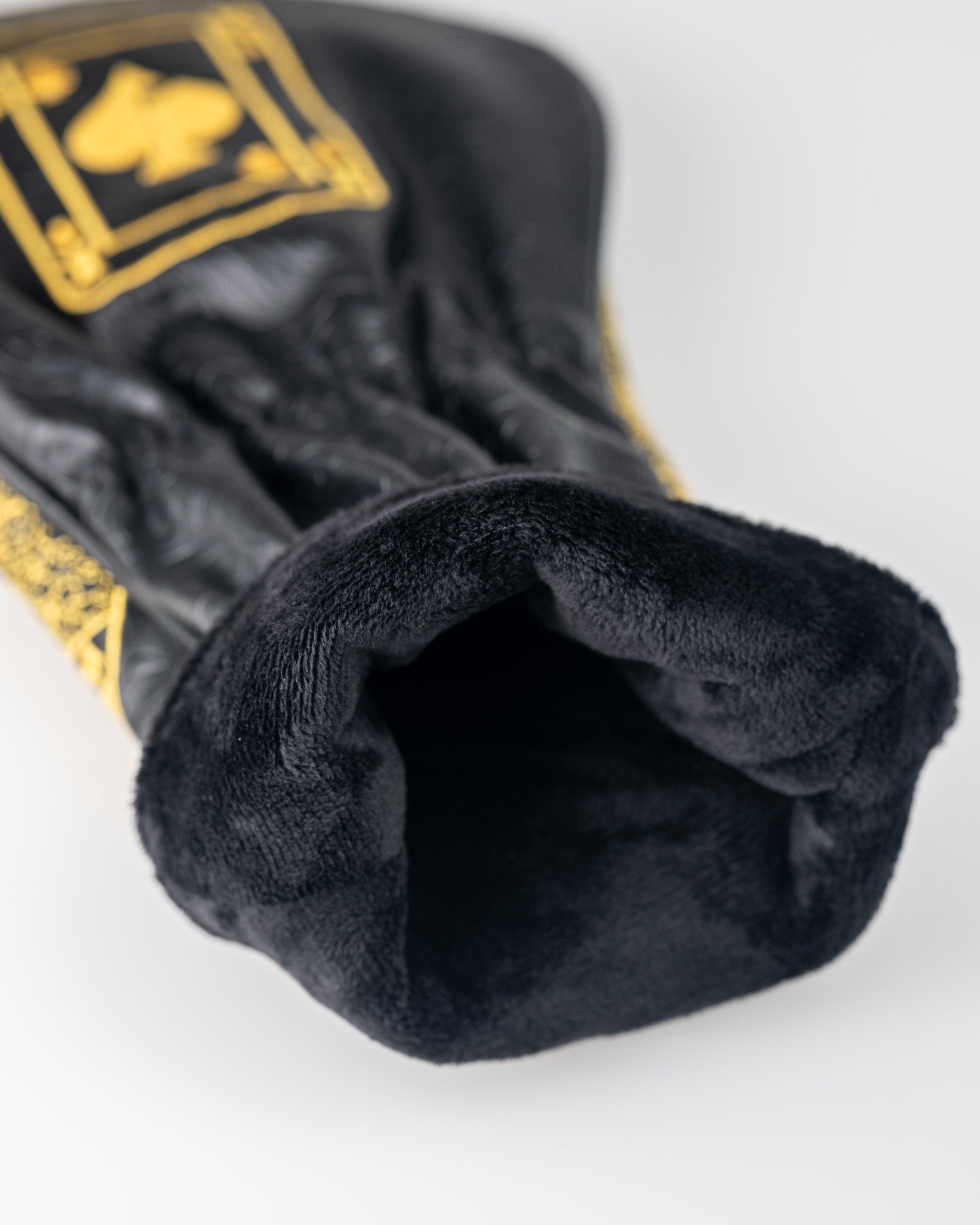 Black and gold King of Spades driver cover featuring a plush interior for protection and style on the golf course.
