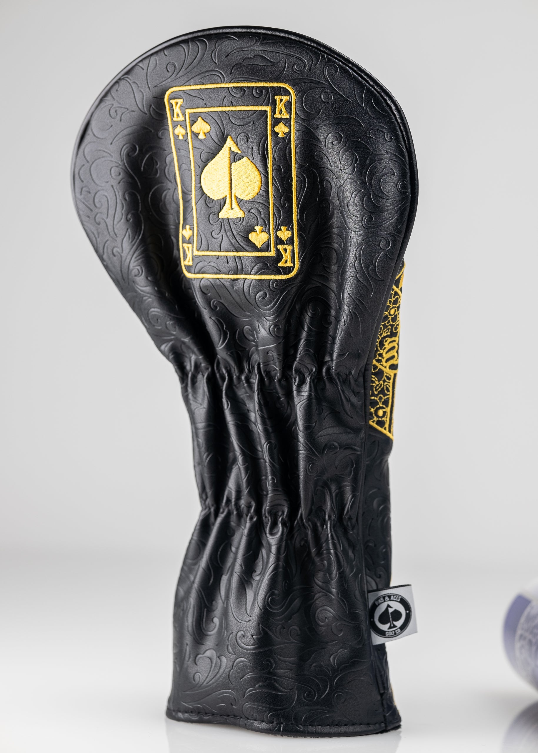 Black and gold King of Spades driver cover featuring intricate designs, perfect for golfers seeking a bold accessory.