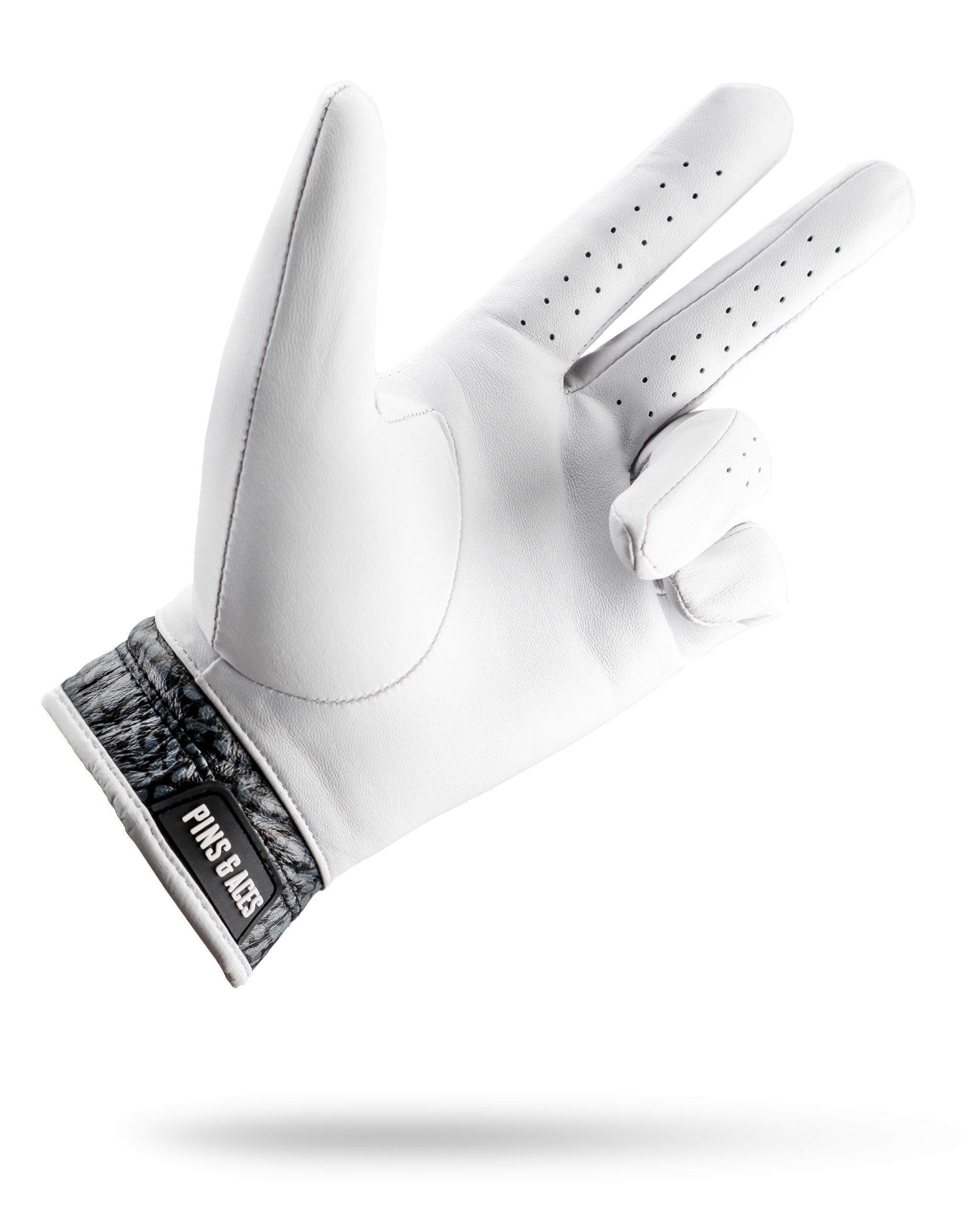 Premium golf glove featuring a stylish elephant print cuff, designed for comfort and grip on the course.