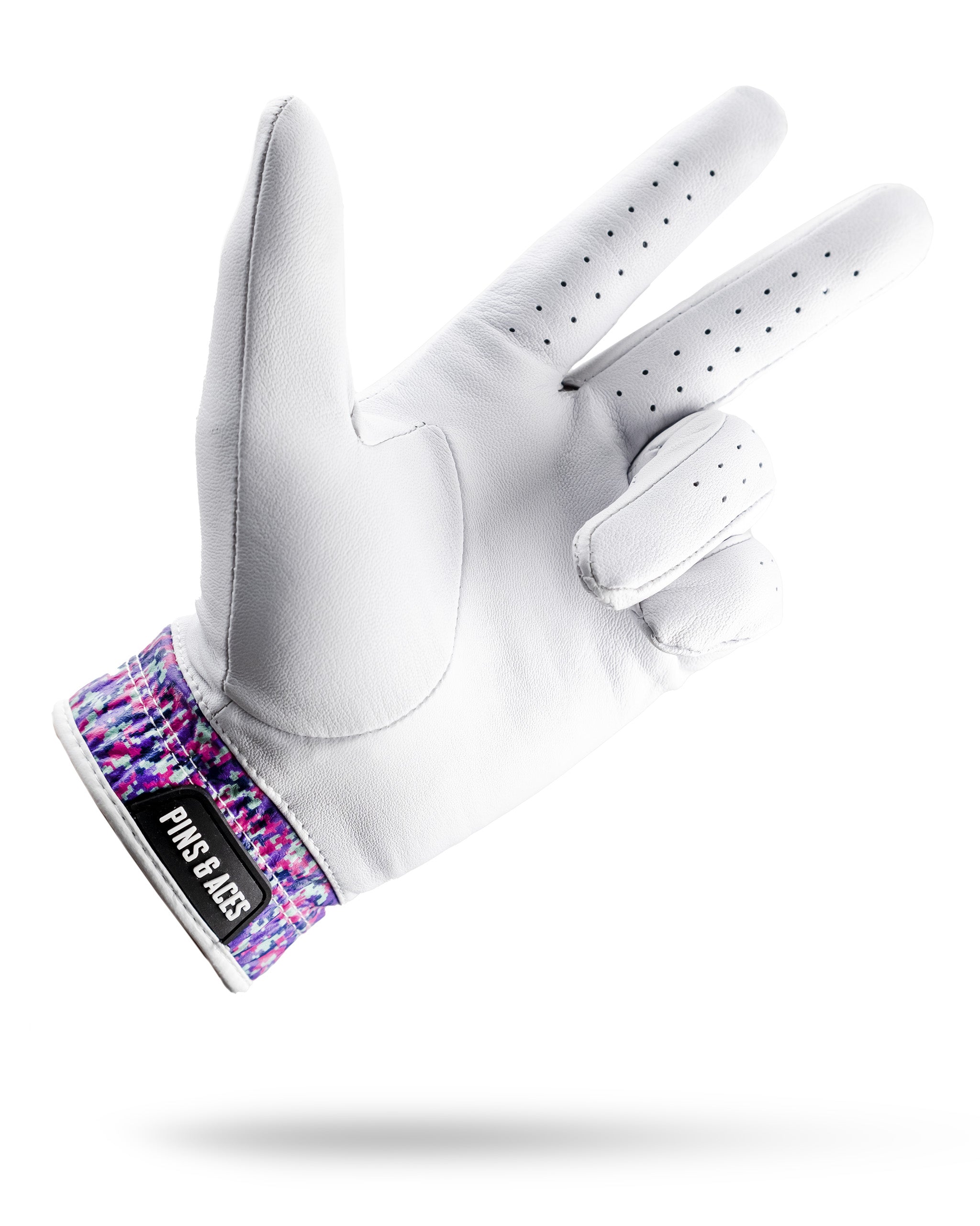 Premium Tour Glove in vivid camo design, featuring a white leather palm and colorful patterned wristband for golfers.