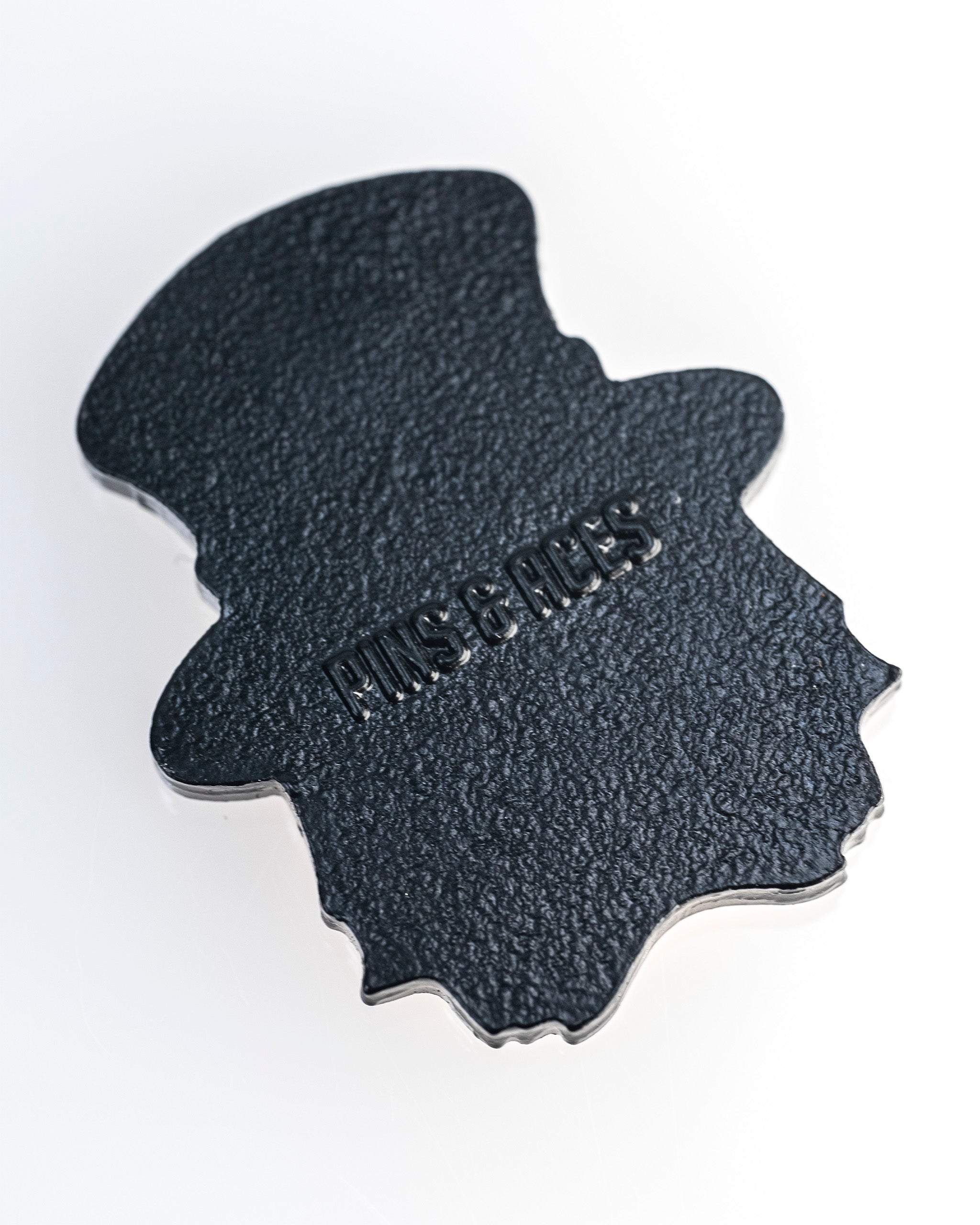 Seamus the Degenerate Ball Marker features a unique top hat design with a textured finish, perfect for stylish golfers.