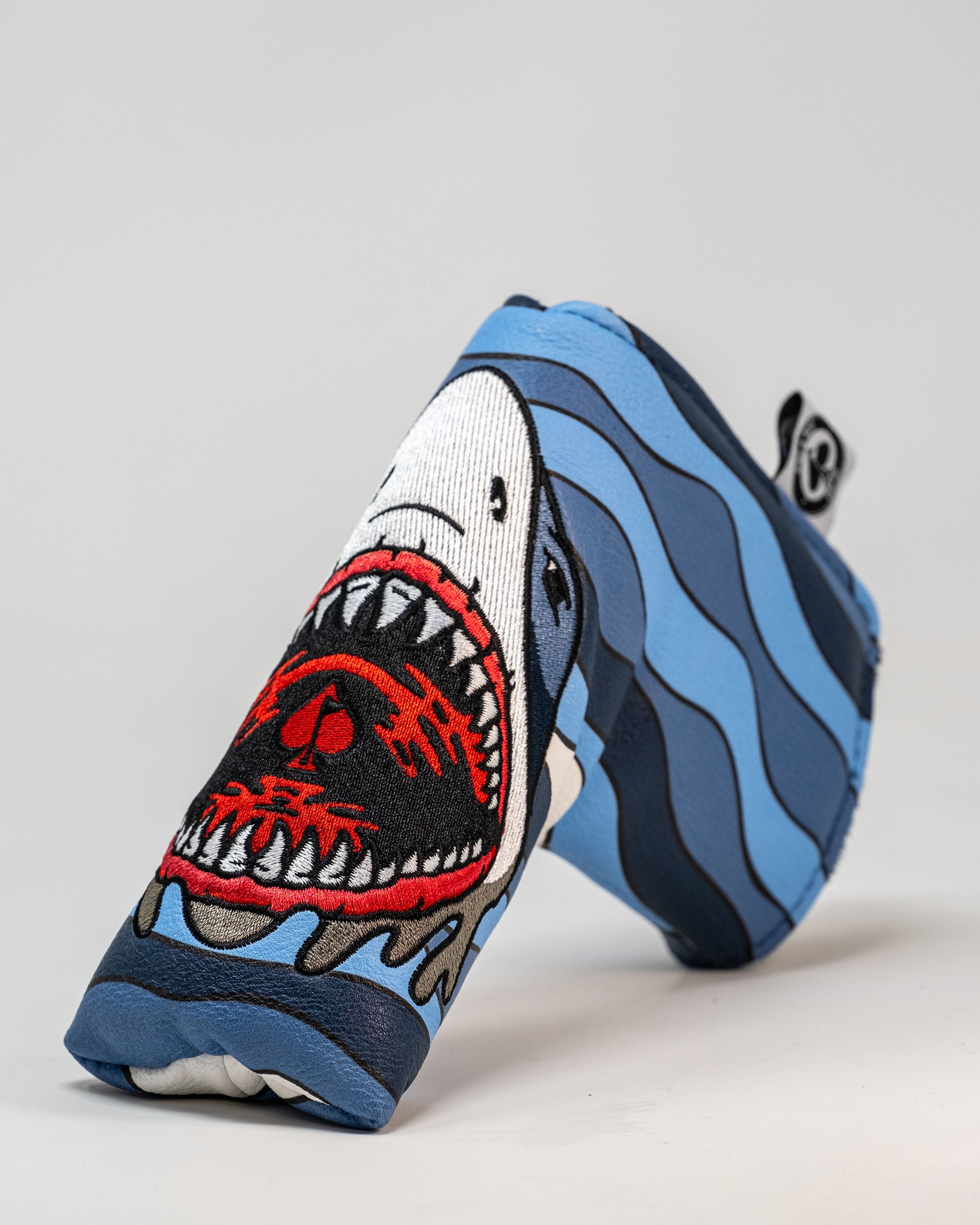 Bold Shark Attack blade putter cover featuring a fierce shark design with vibrant colors, perfect for standout golfers.