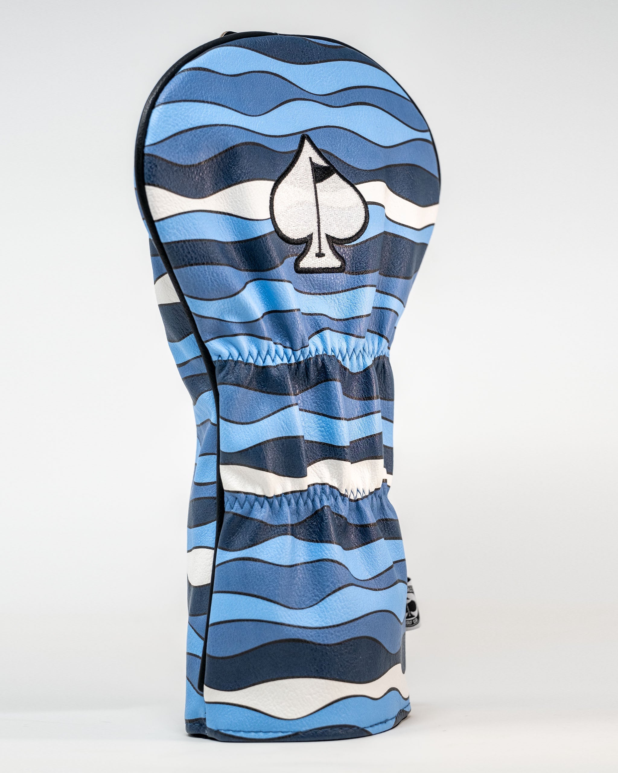 Bold shark-themed driver cover featuring blue wave patterns and a spade logo, designed for golfers who want to stand out.