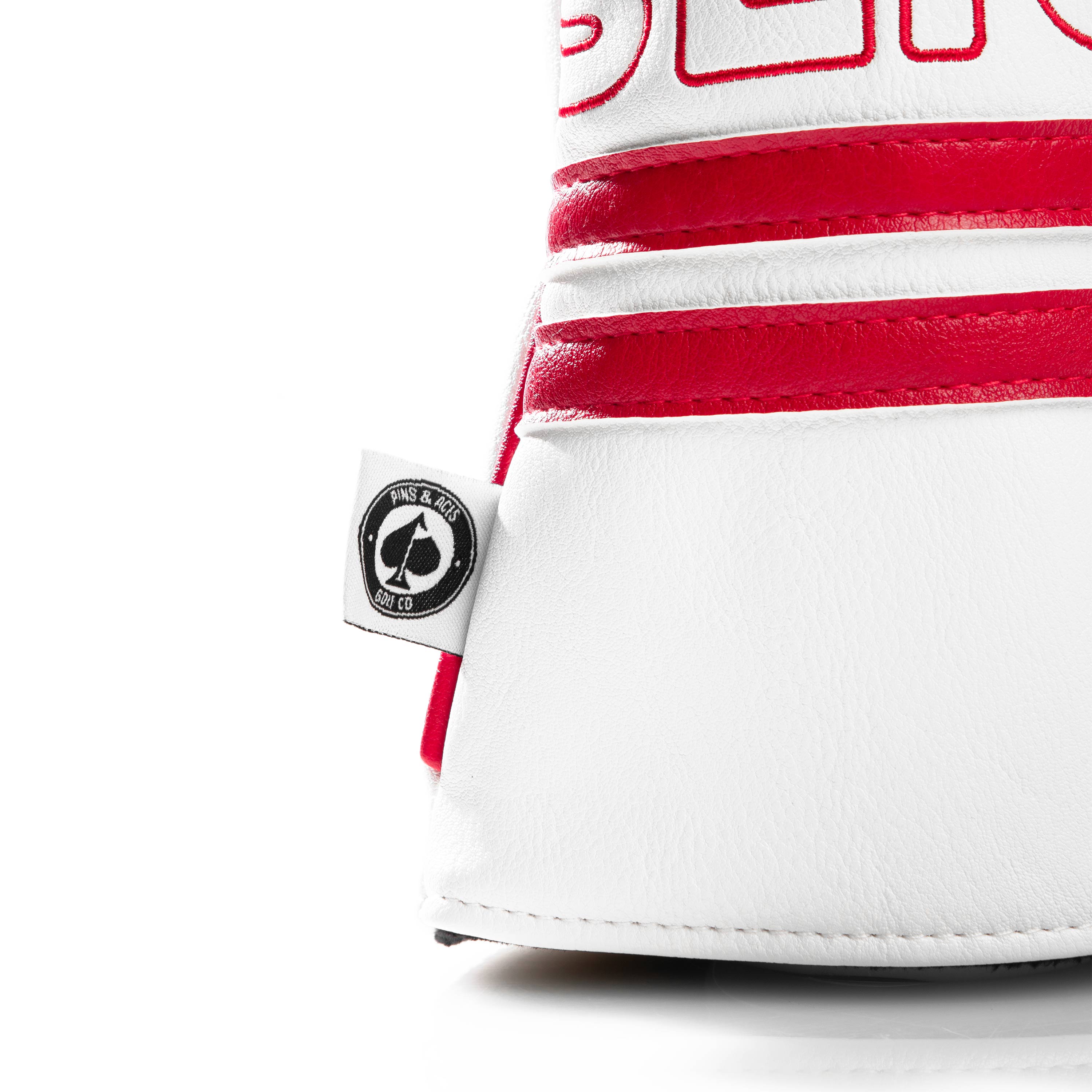 Bold white driver cover with red accents and "Slice" branding, designed for golfers seeking unique style on the course.