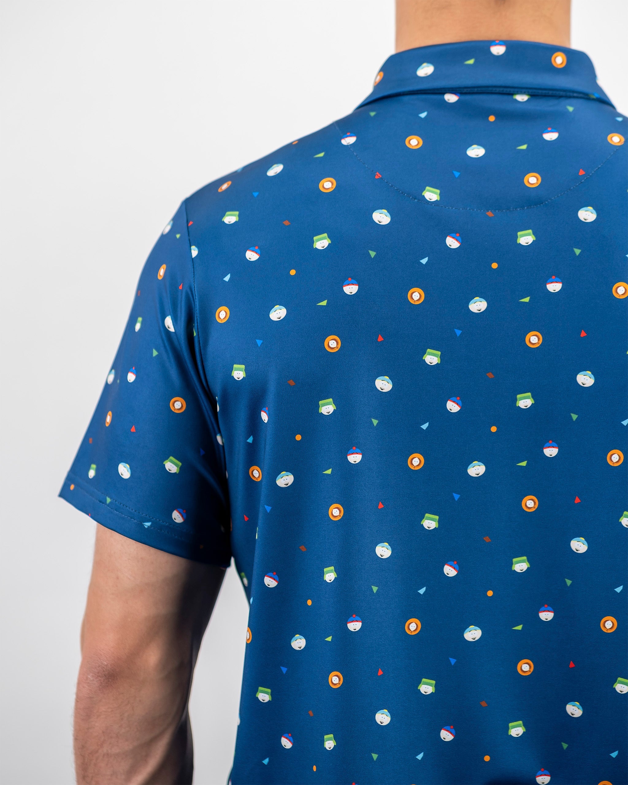 Men's South Park classic golf shirt featuring a vibrant blue background with playful cartoon-themed patterns.