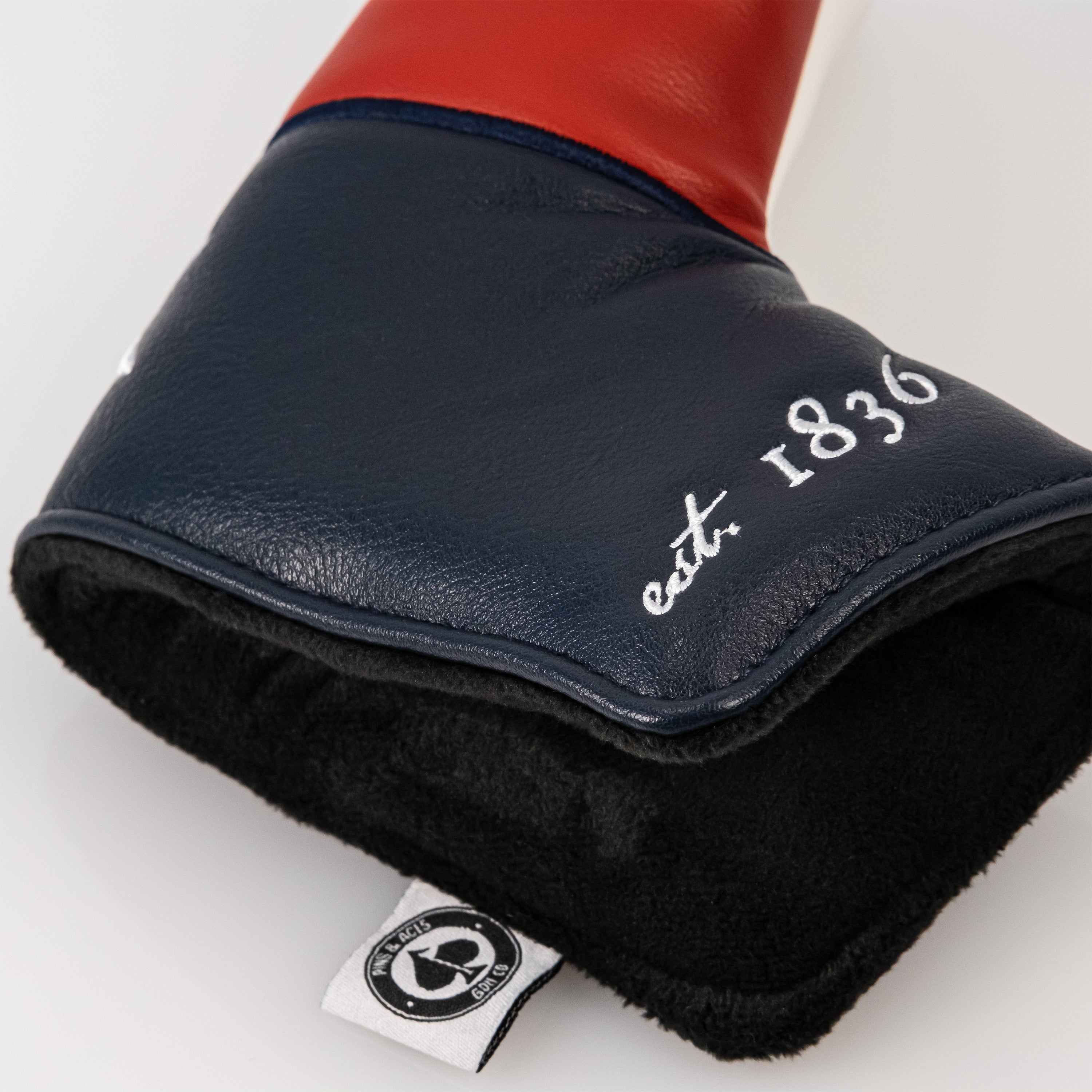 Texas Lone Star blade putter cover featuring a bold red and navy design with a soft interior for protection.