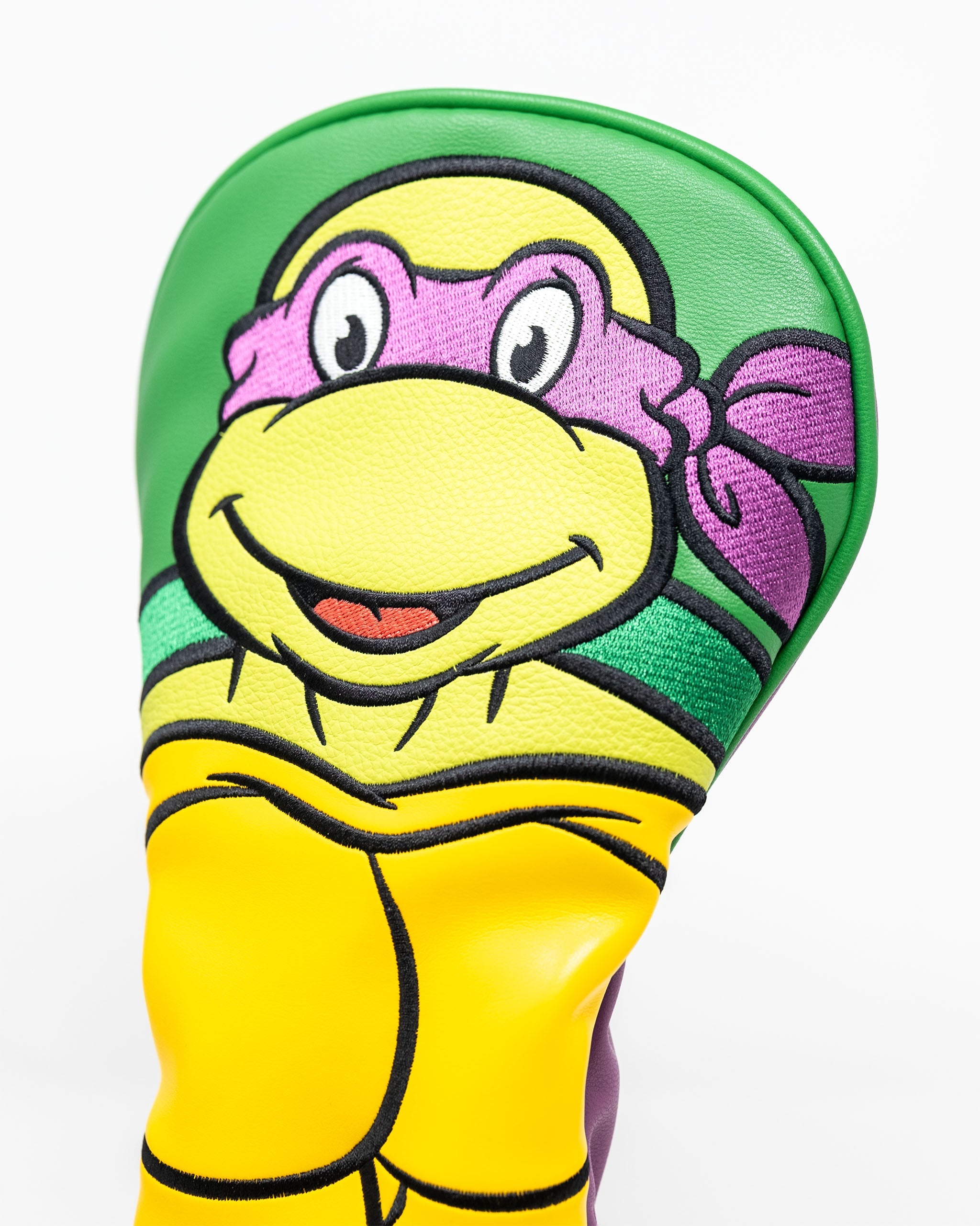 TMNT Donatello driver cover featuring vibrant colors and a playful design of the character's face and outfit.