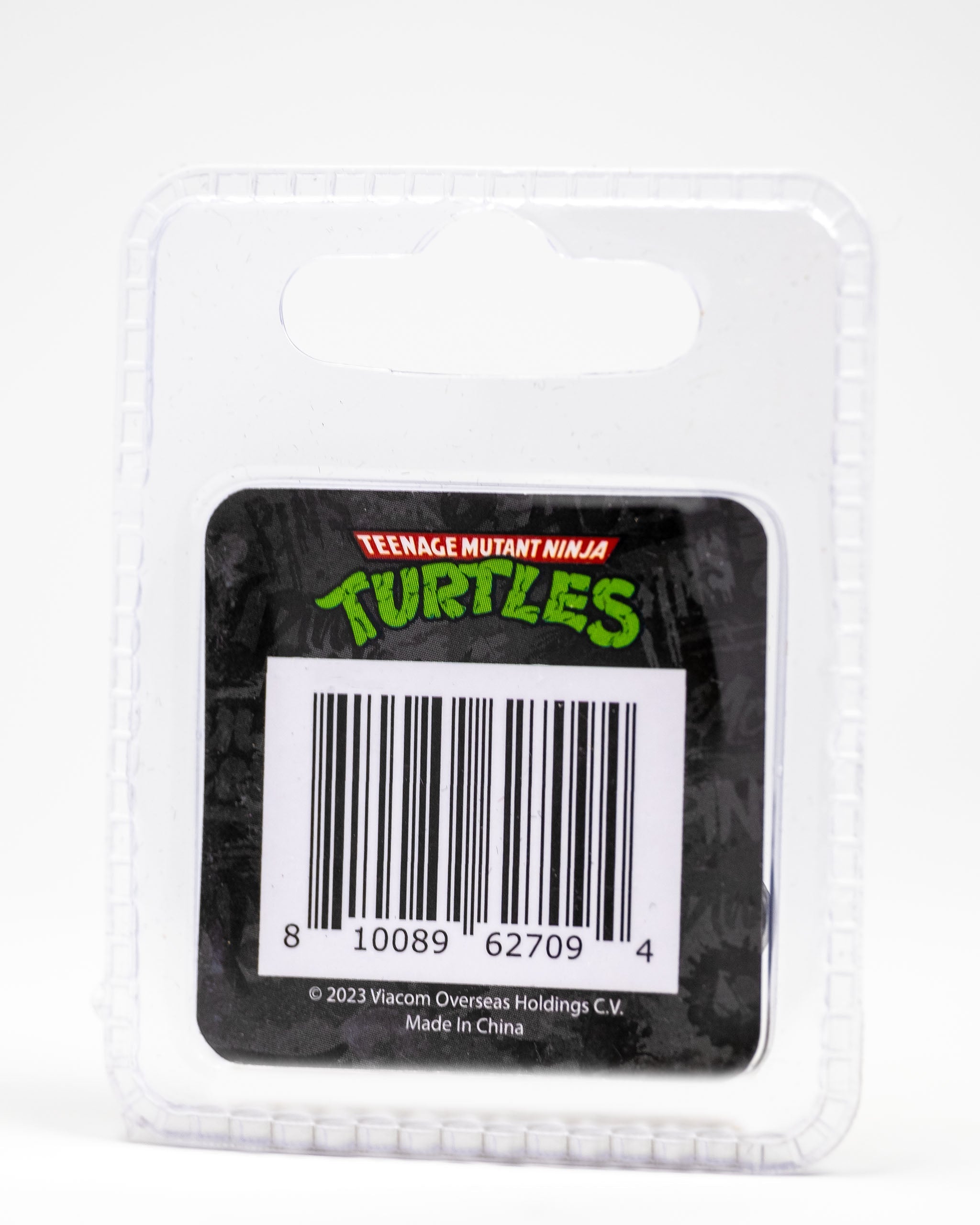 TMNT Raphael ball marker in packaging featuring Teenage Mutant Ninja Turtles branding and a barcode.