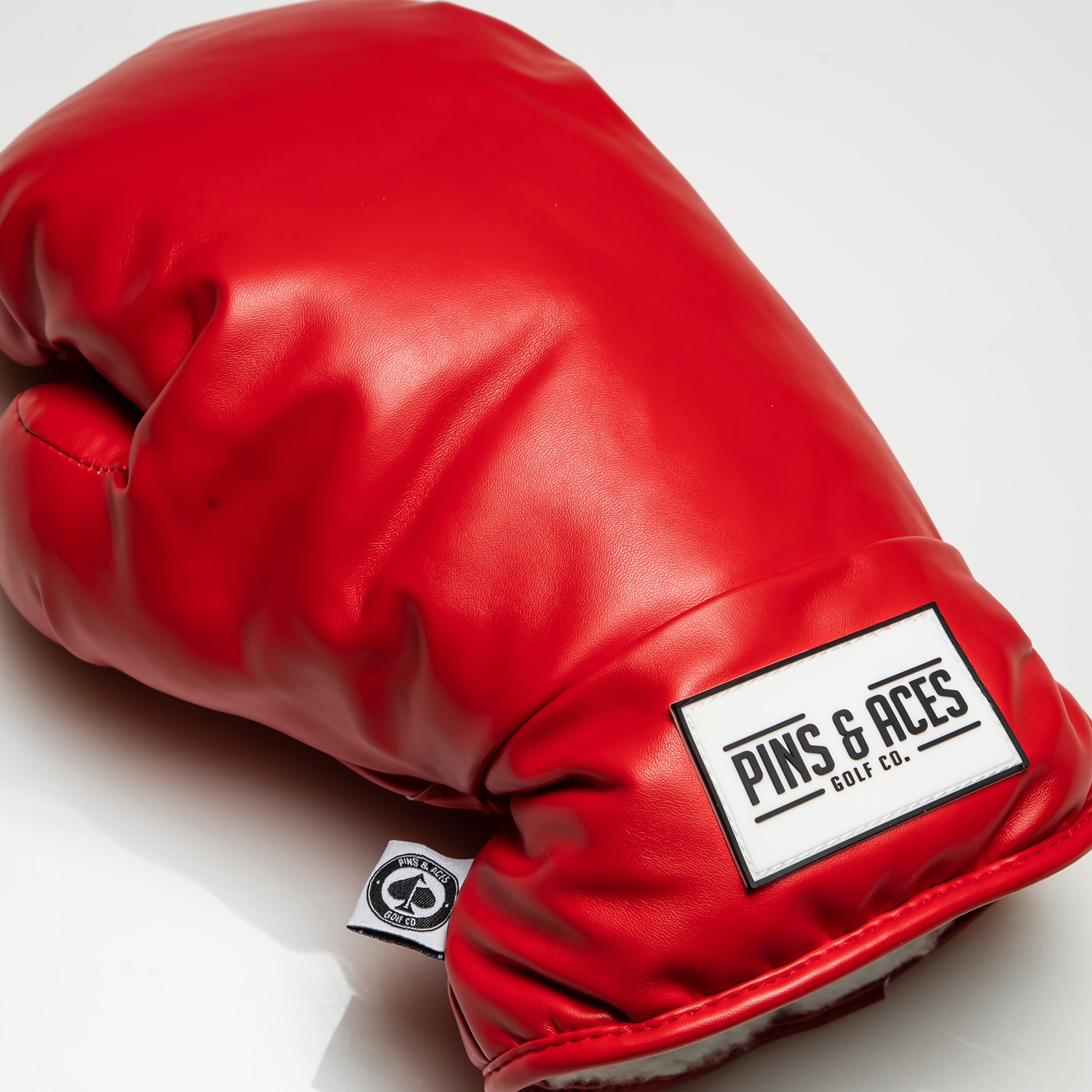 Red boxing glove driver cover for golf clubs.