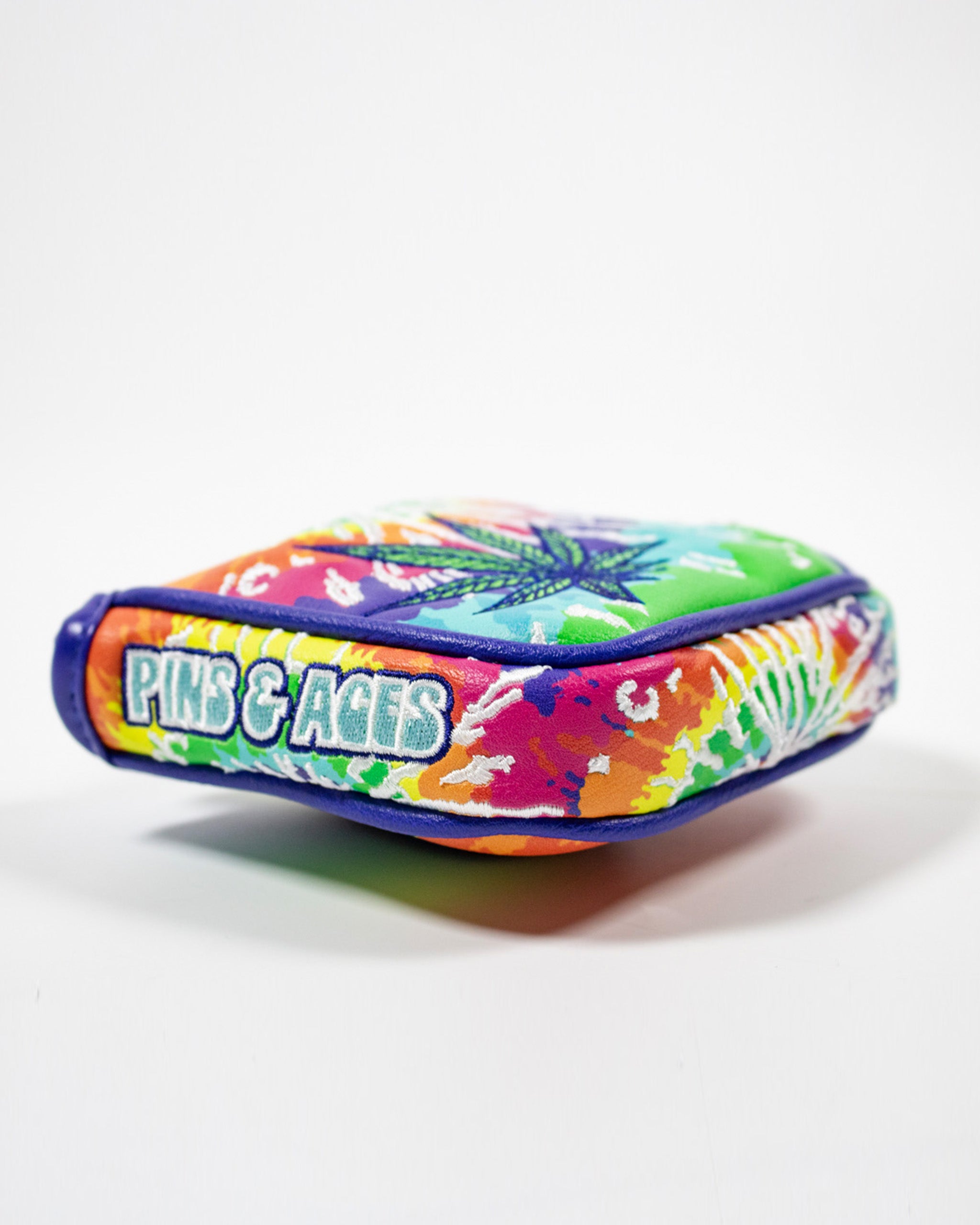 Colorful Puff Puff Putt mallet putter cover featuring a vibrant design and "Pins & Ages" branding.