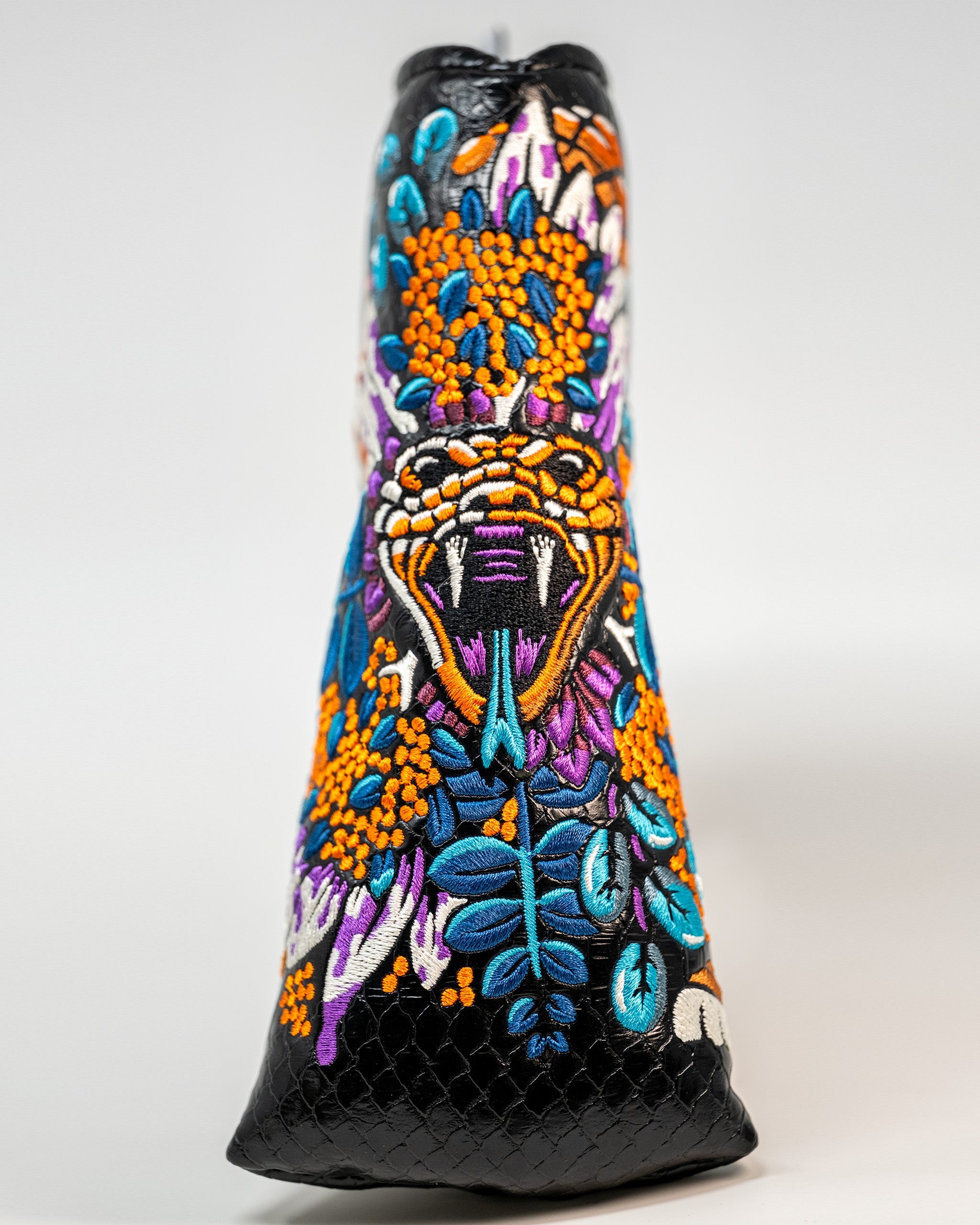 Bold Venom Blade Putter Cover featuring vibrant embroidery of a snake and floral designs, perfect for standout golf style.