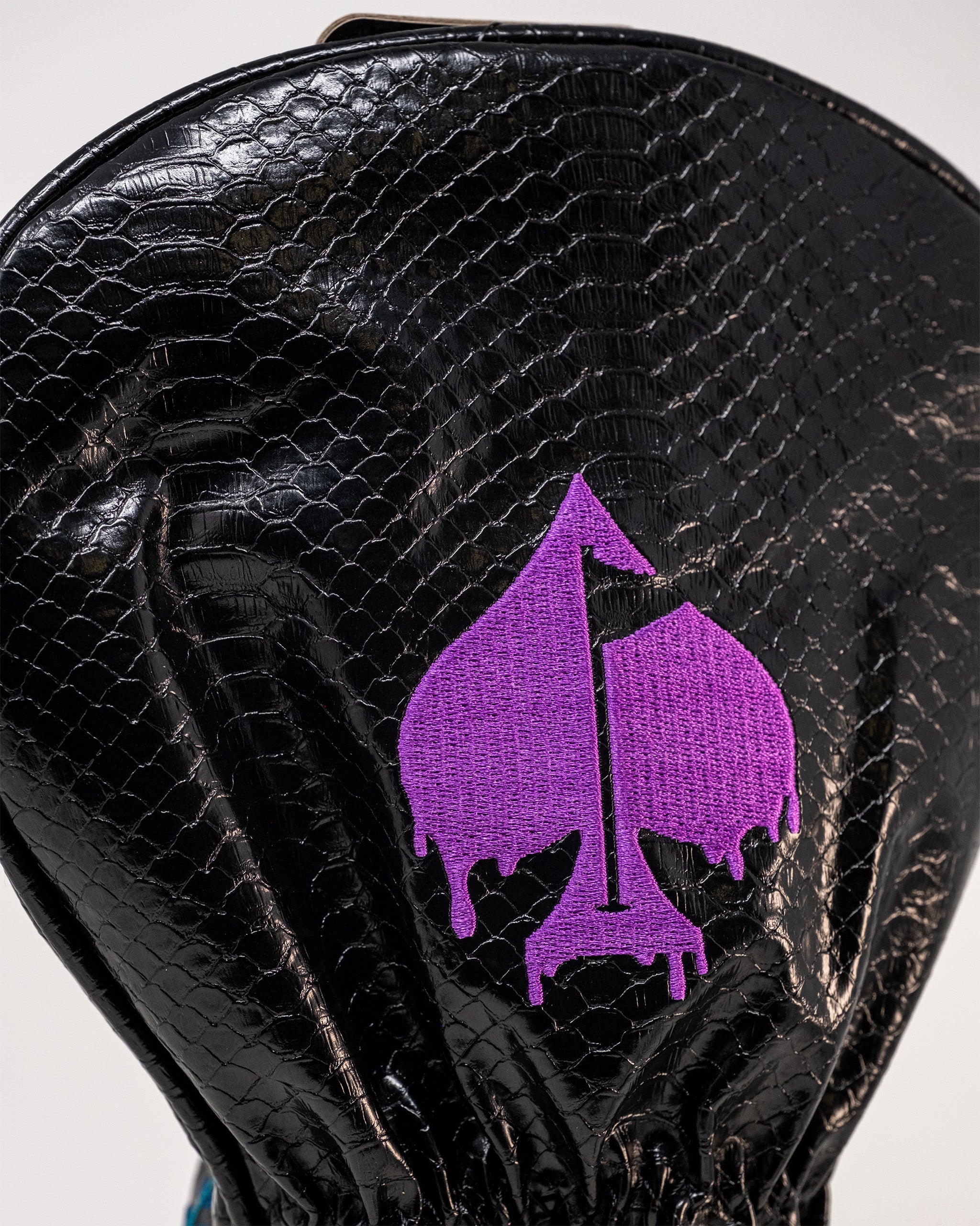 Bold Venom Driver Cover featuring a textured black design and a striking purple spade logo, perfect for standout golfers.