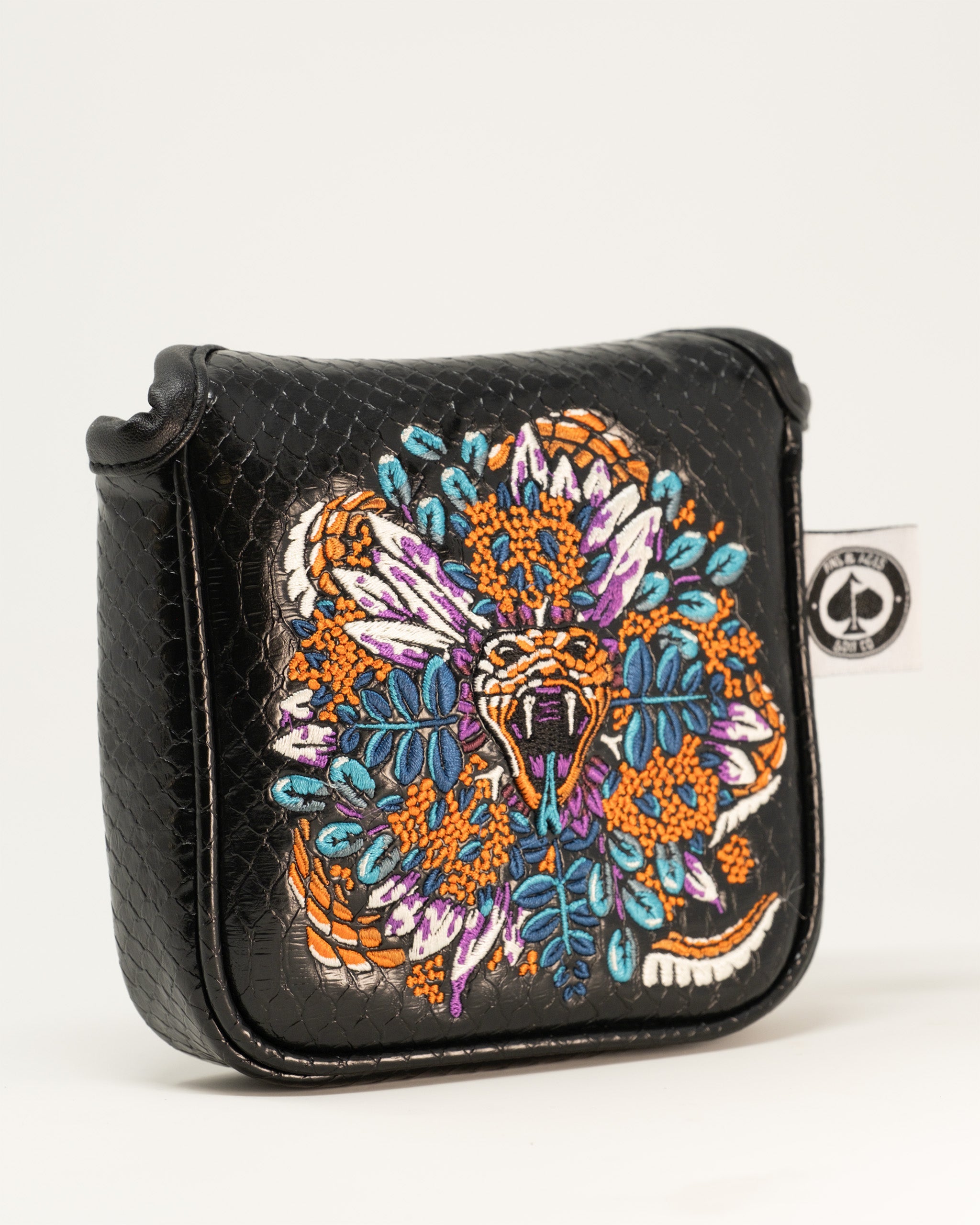 Bold Venom Mallet Cover featuring intricate snake and floral embroidery on a textured black background.