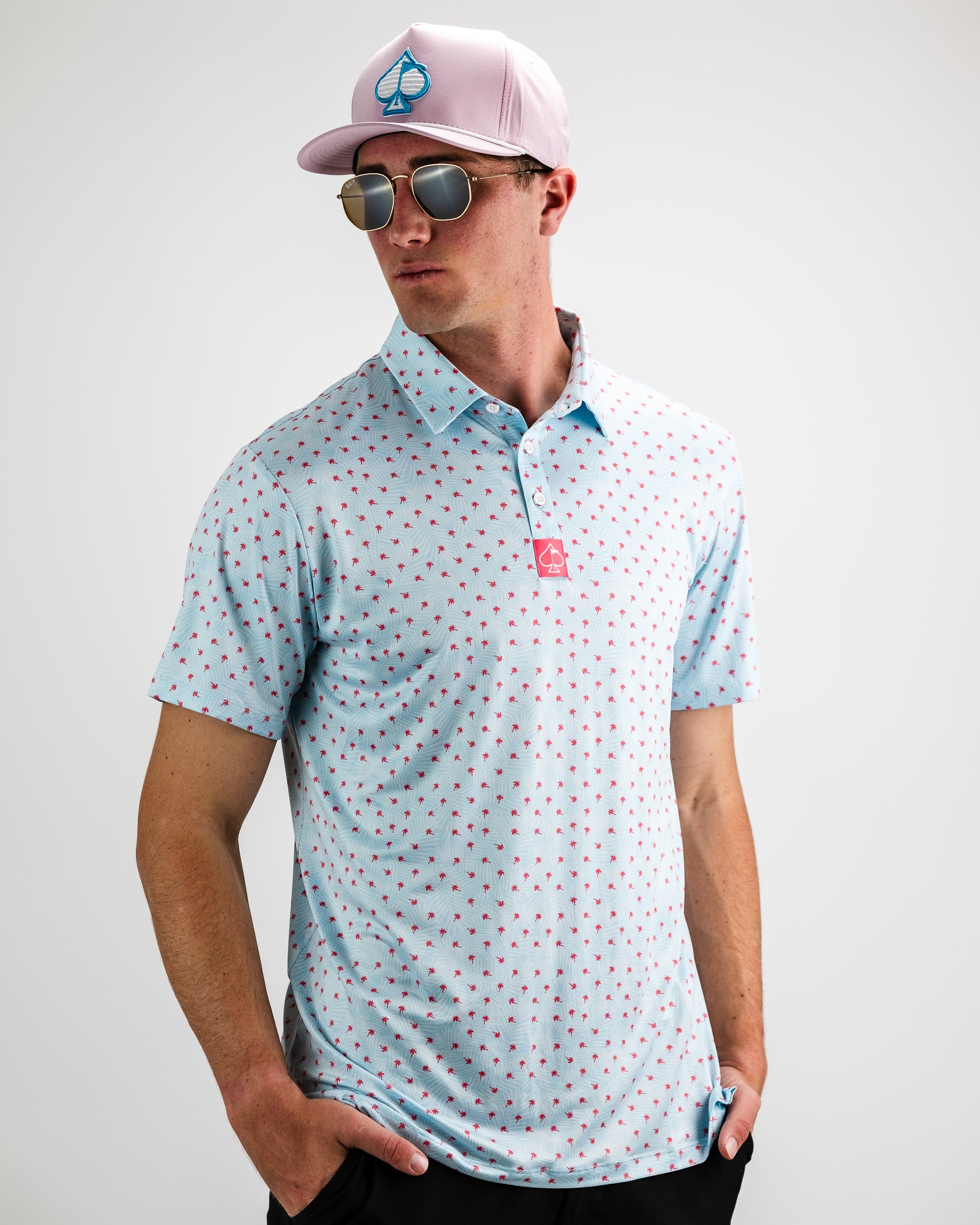 Model wearing a blue floral dress for Palm Sunday, featuring a flowy silhouette and short sleeves, set against a neutral backdrop.