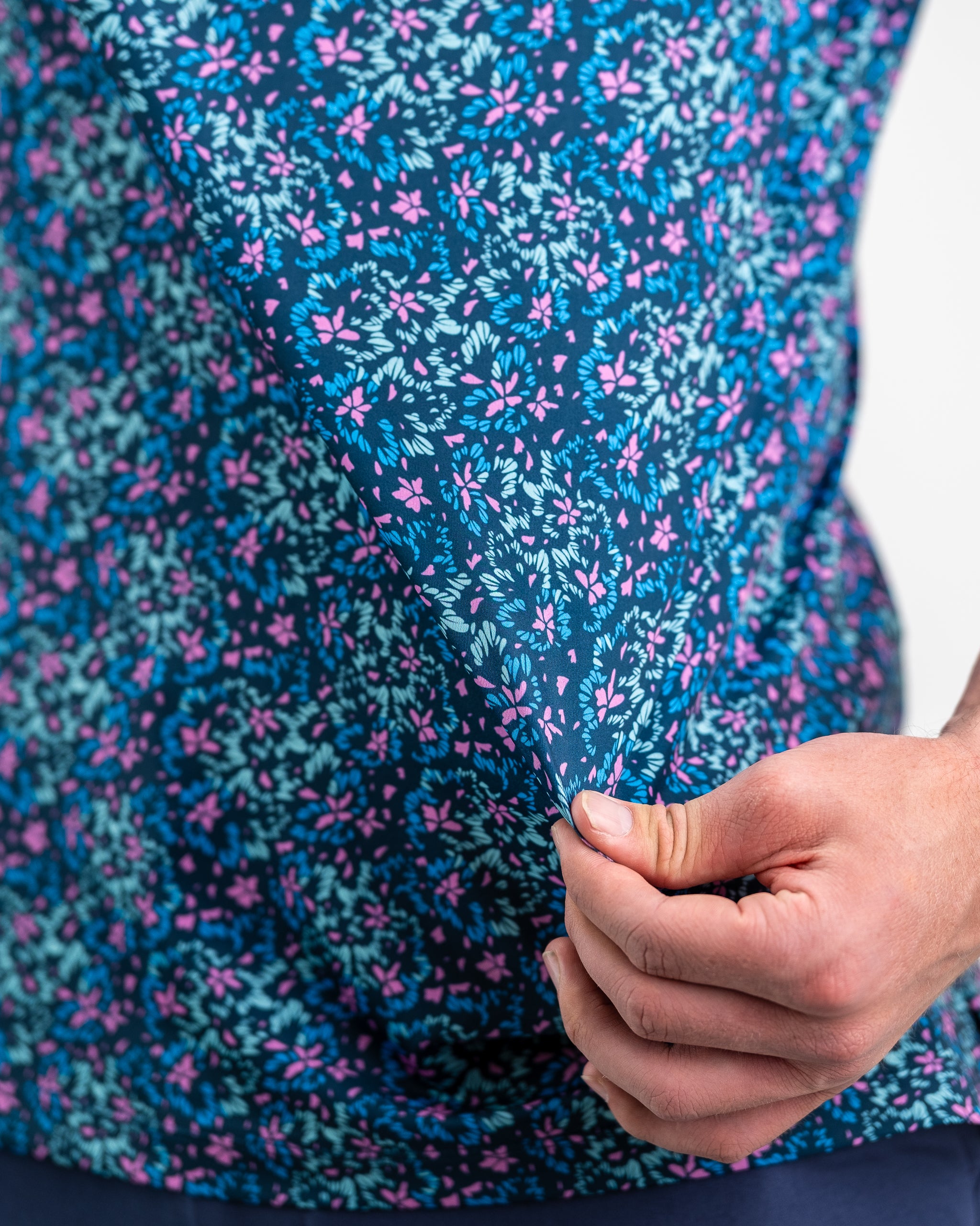 Fluorescent floral dress featuring vibrant colors and a playful design, perfect for spring fashion.