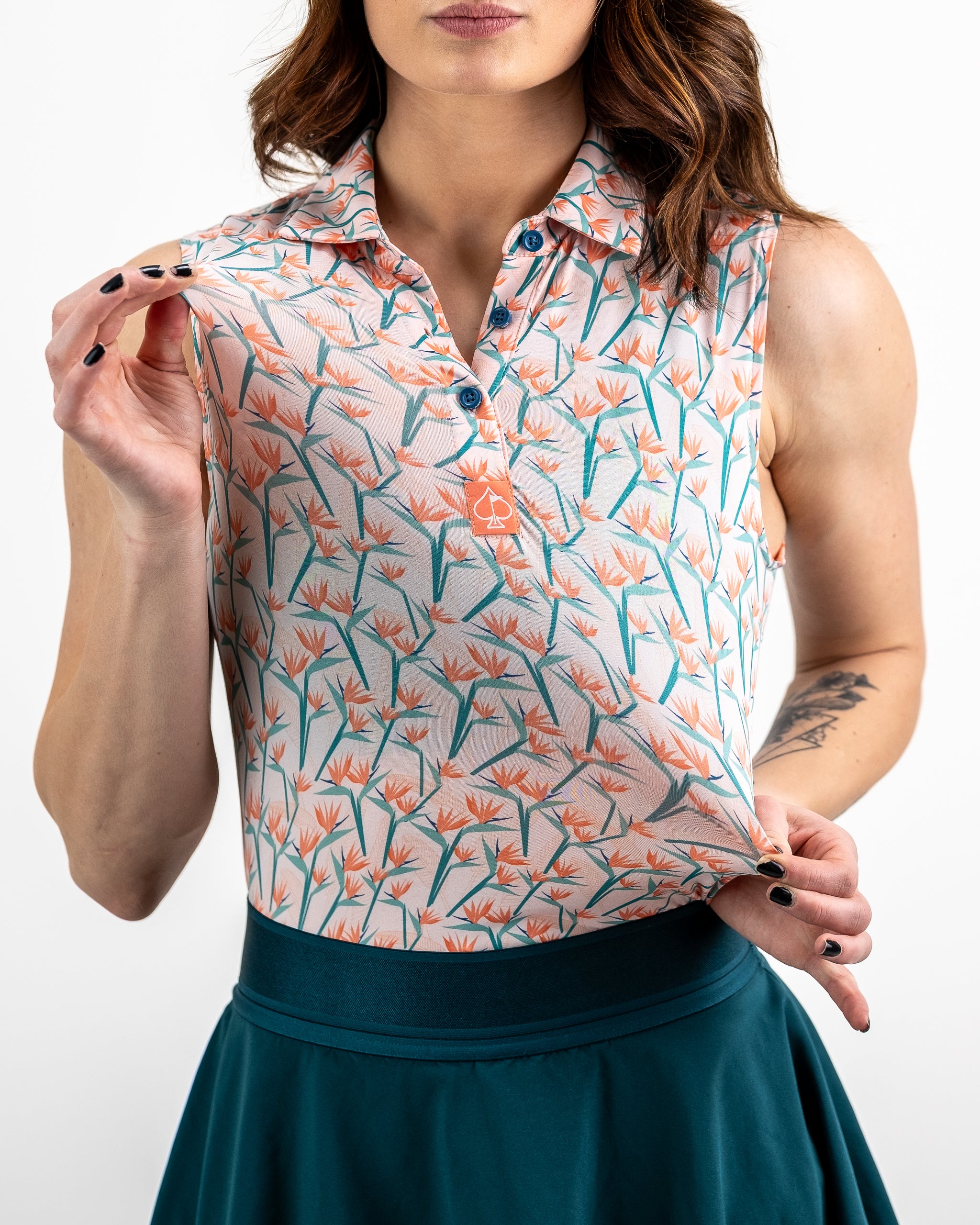 Alt text: "Model wearing Women's Birds of Paradise dress featuring vibrant tropical print and flowing silhouette."