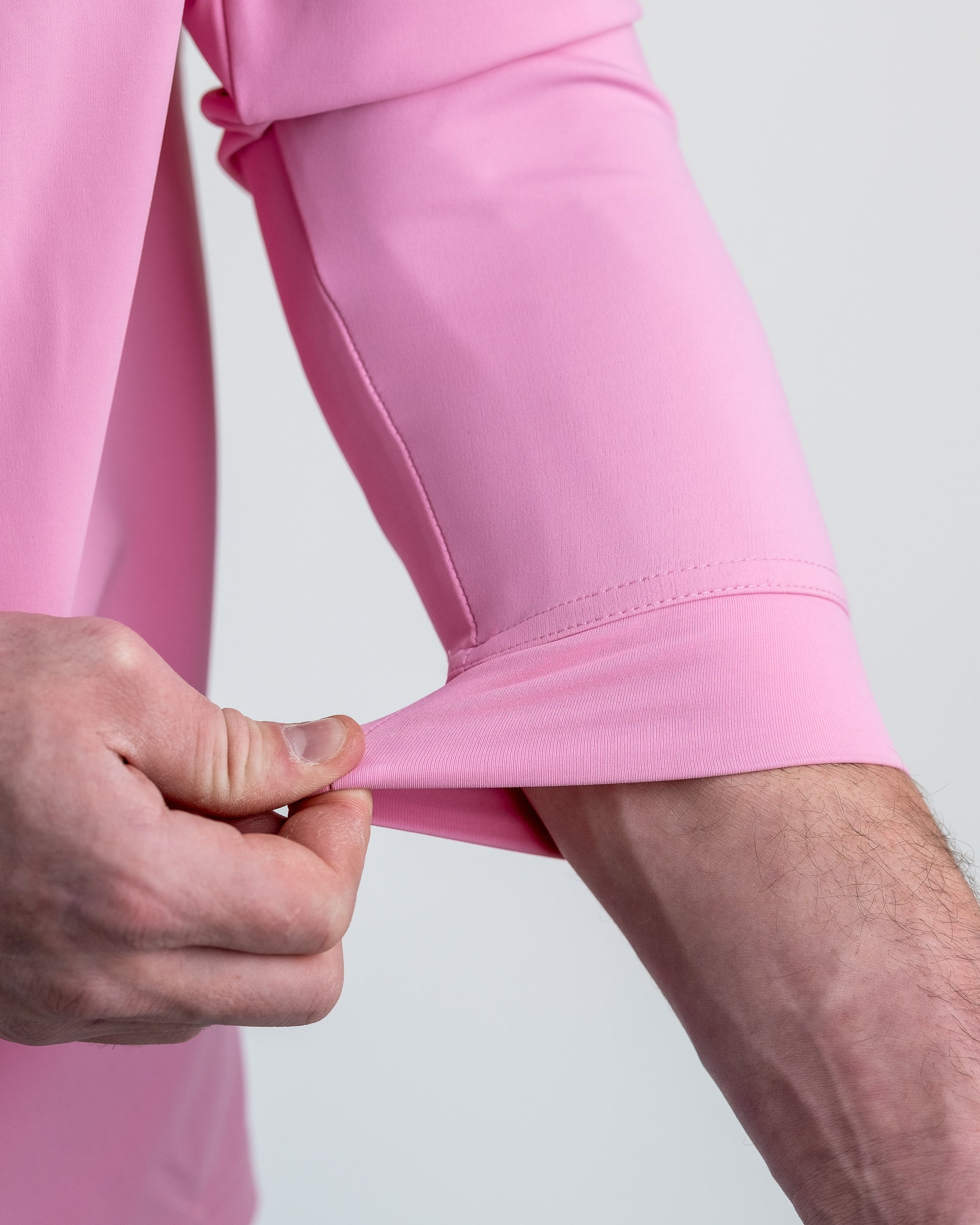 Performance Golf Hoodie in Flamingo Shatter pattern, featuring a vibrant pink and white design, designed for golf enthusiasts.