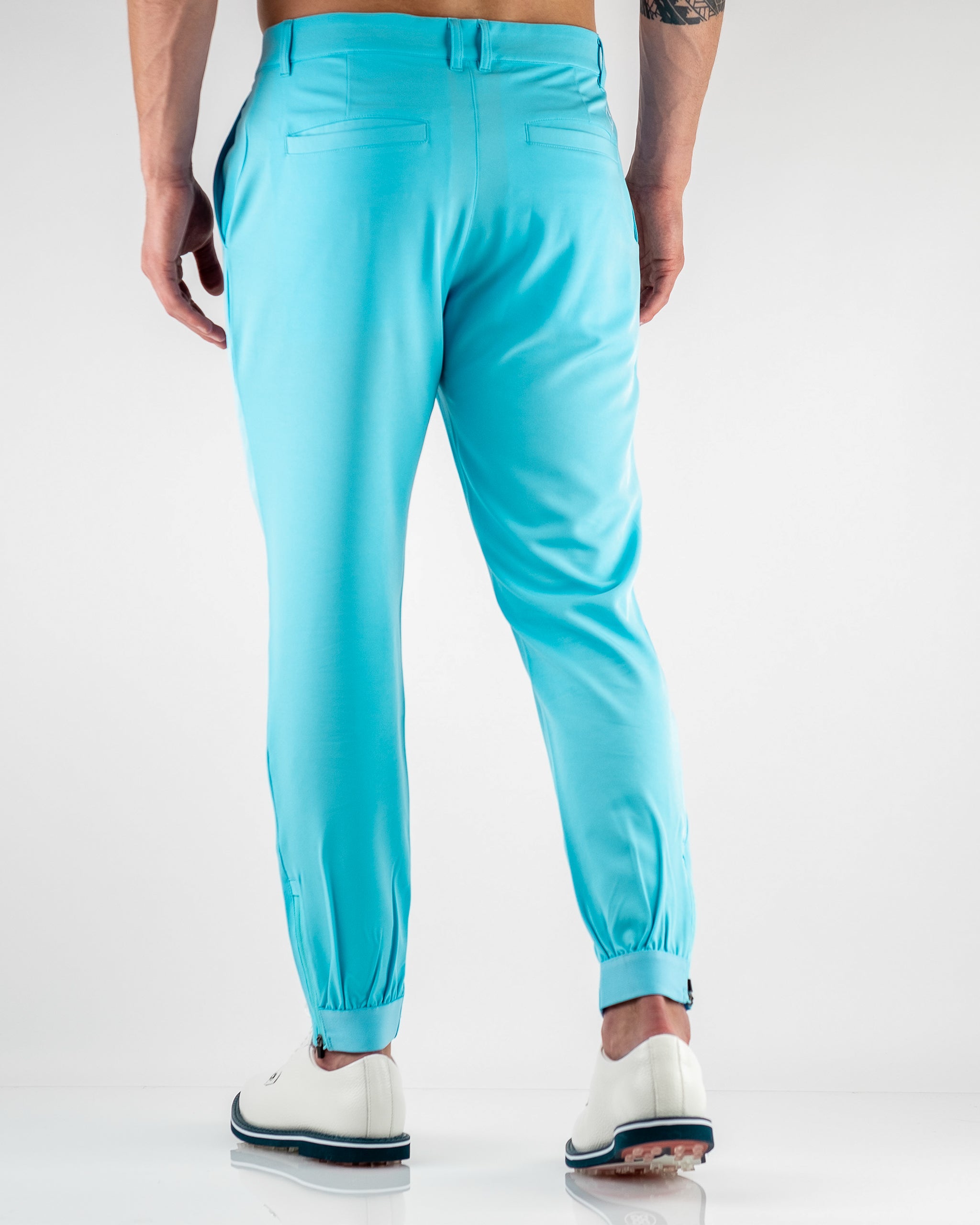Sky blue performance jogger featured on a model, showcasing a sleek design and comfortable fit for active wear.