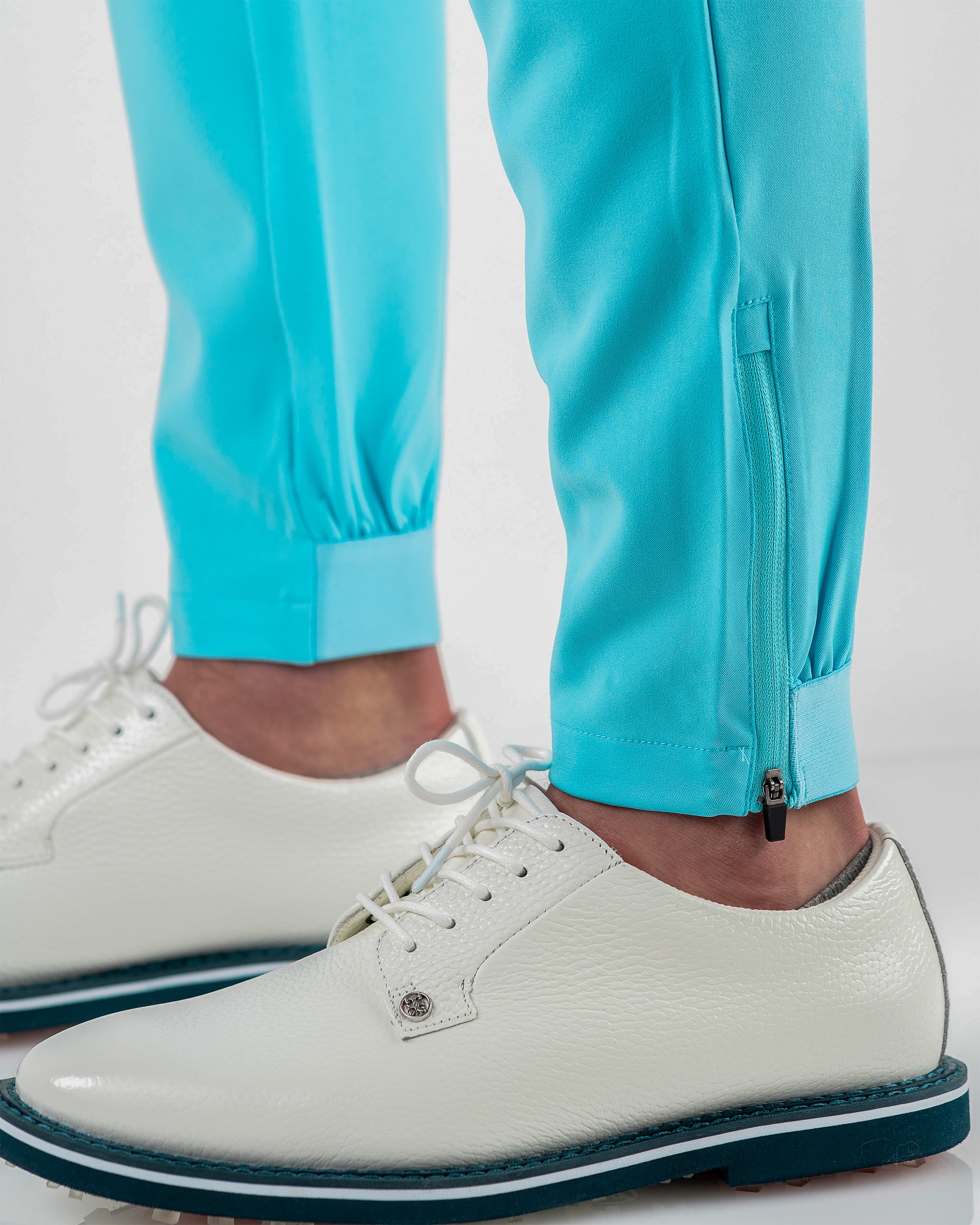 Performance Jogger in Sky Blue, featuring an elastic waistband and relaxed fit, displayed on a model.