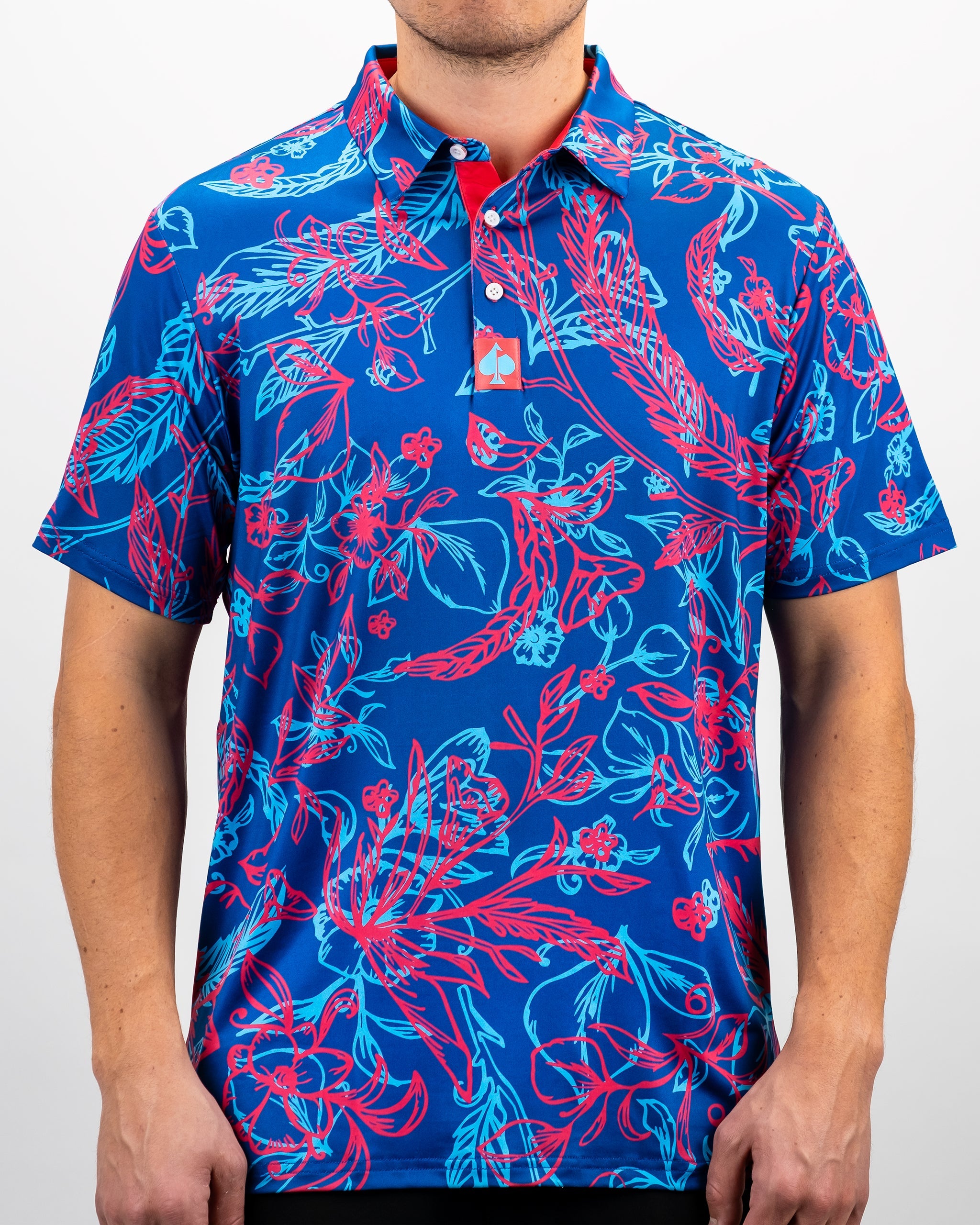 Bold blue golf polo featuring vibrant pink and turquoise floral patterns, perfect for making a statement on the course.